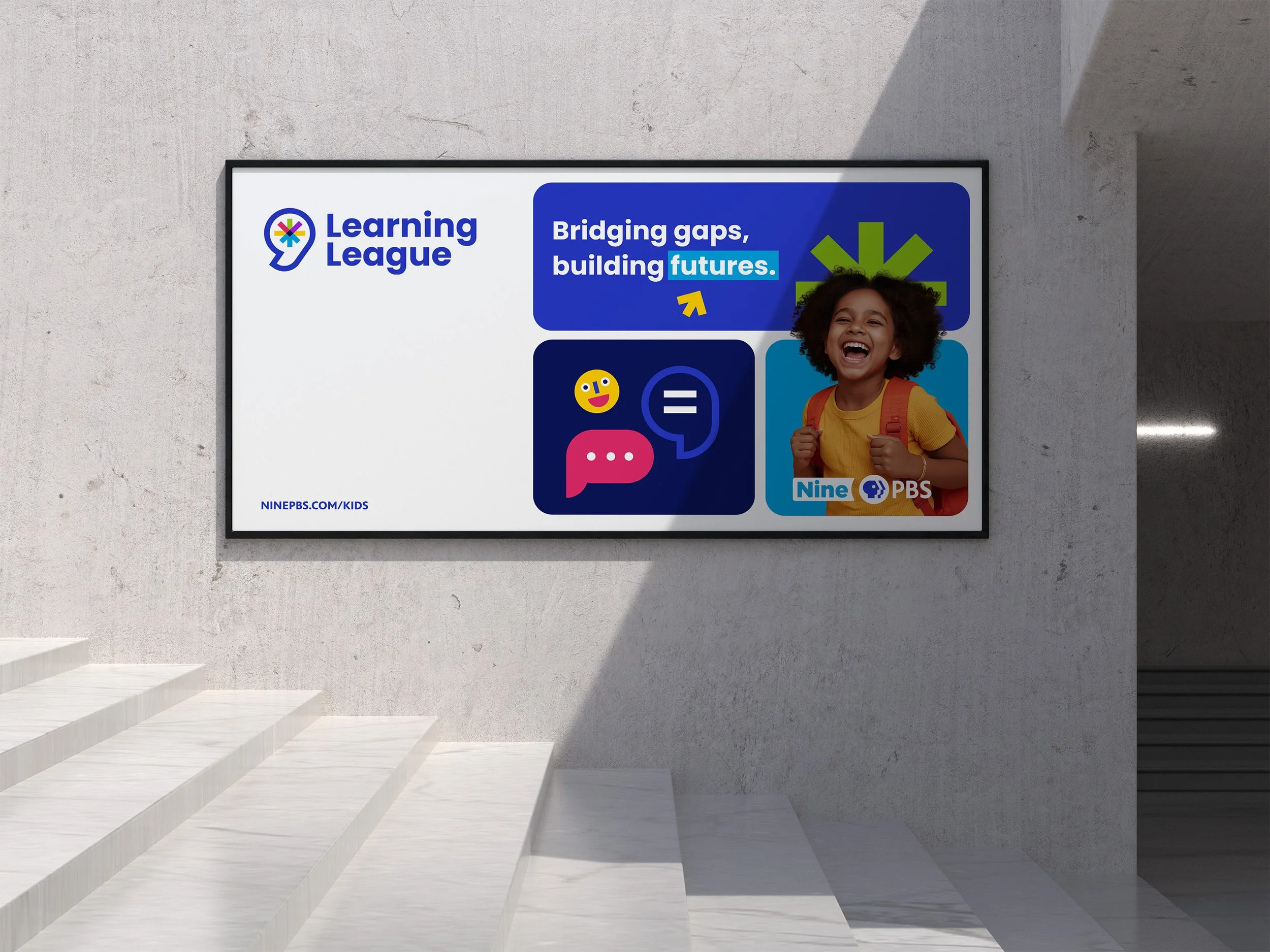 The image shows a billboard of a smiling child and the words "Bridging gaps, building futures."