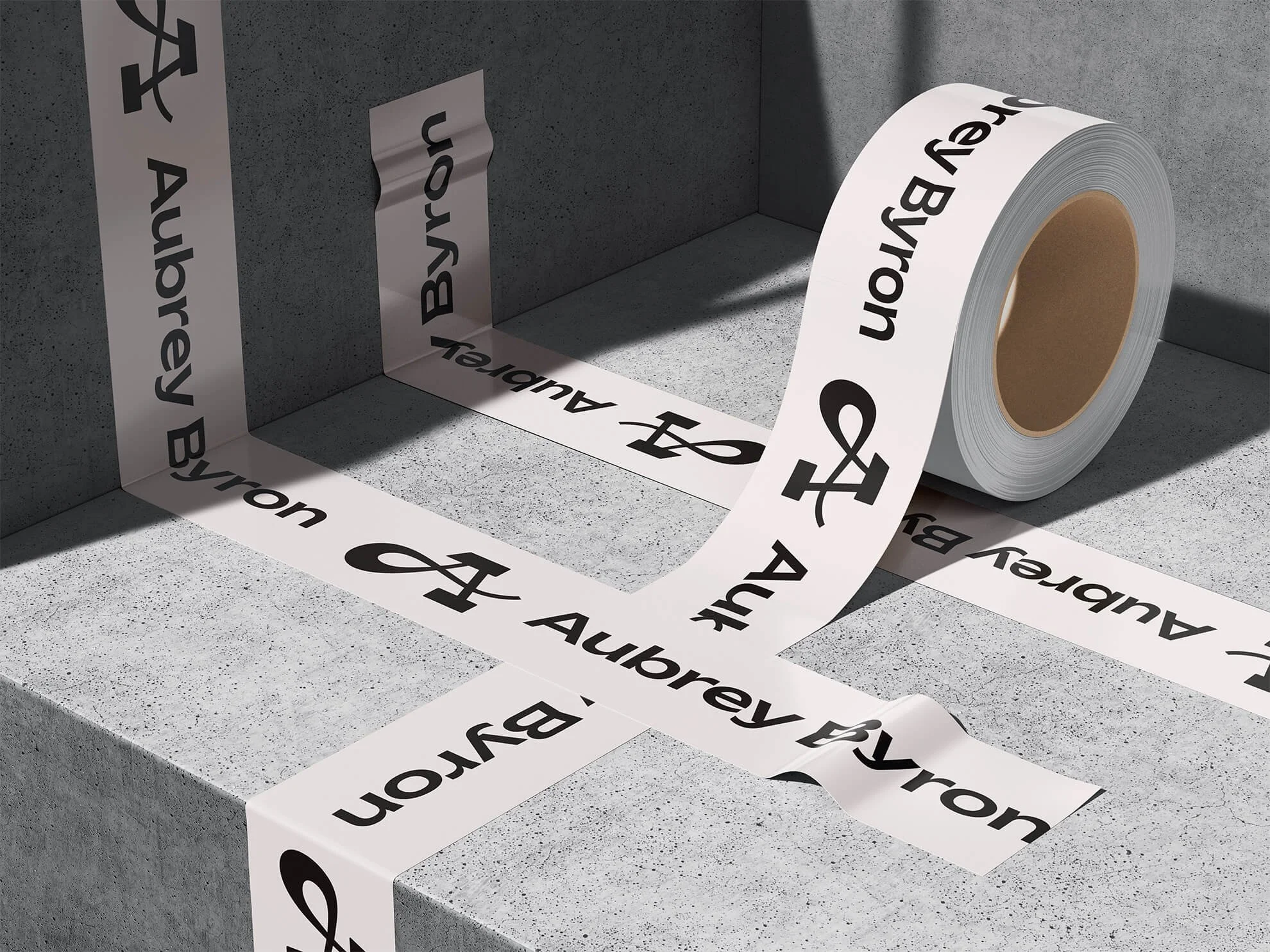 Roll of tape with Aubrey Byron's logo repeated on it