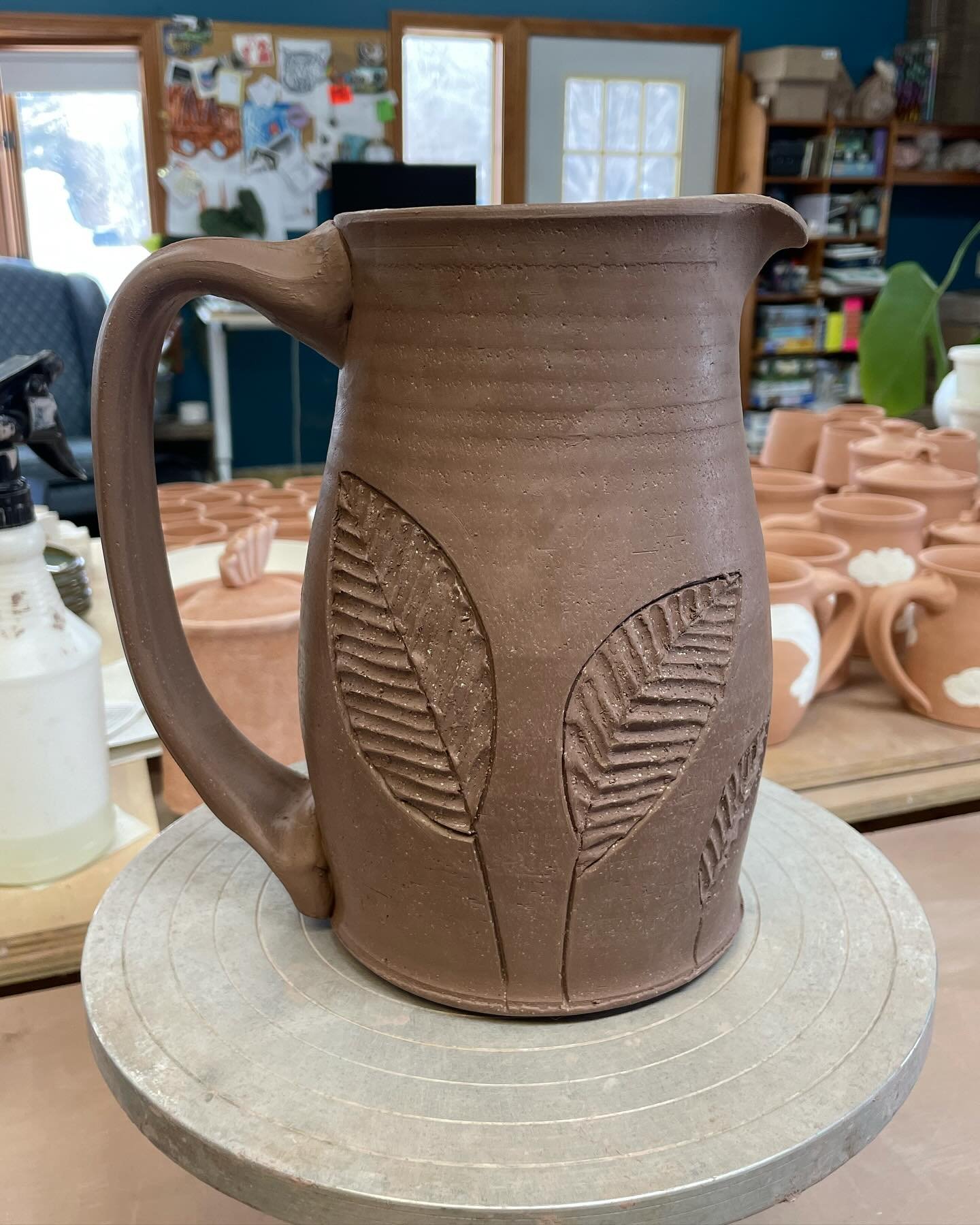 Some big pitchers in the greenware stage &hellip; trying out bigger handles on these tall ones. Some new carvings too, couldn&rsquo;t help it 🤷🏻&zwj;♀️ 
.
Image descriptions: each slide is a tall pitcher made in dark brown stoneware, still in the m