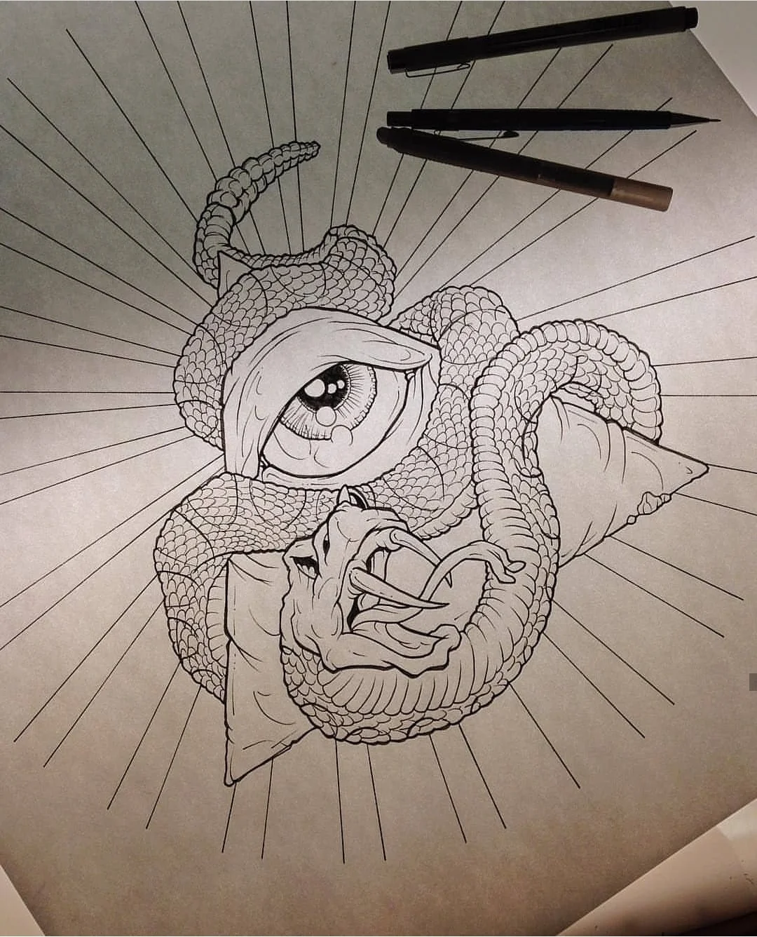 Black and white illustration of a snake wrapping around an eye and pyramid