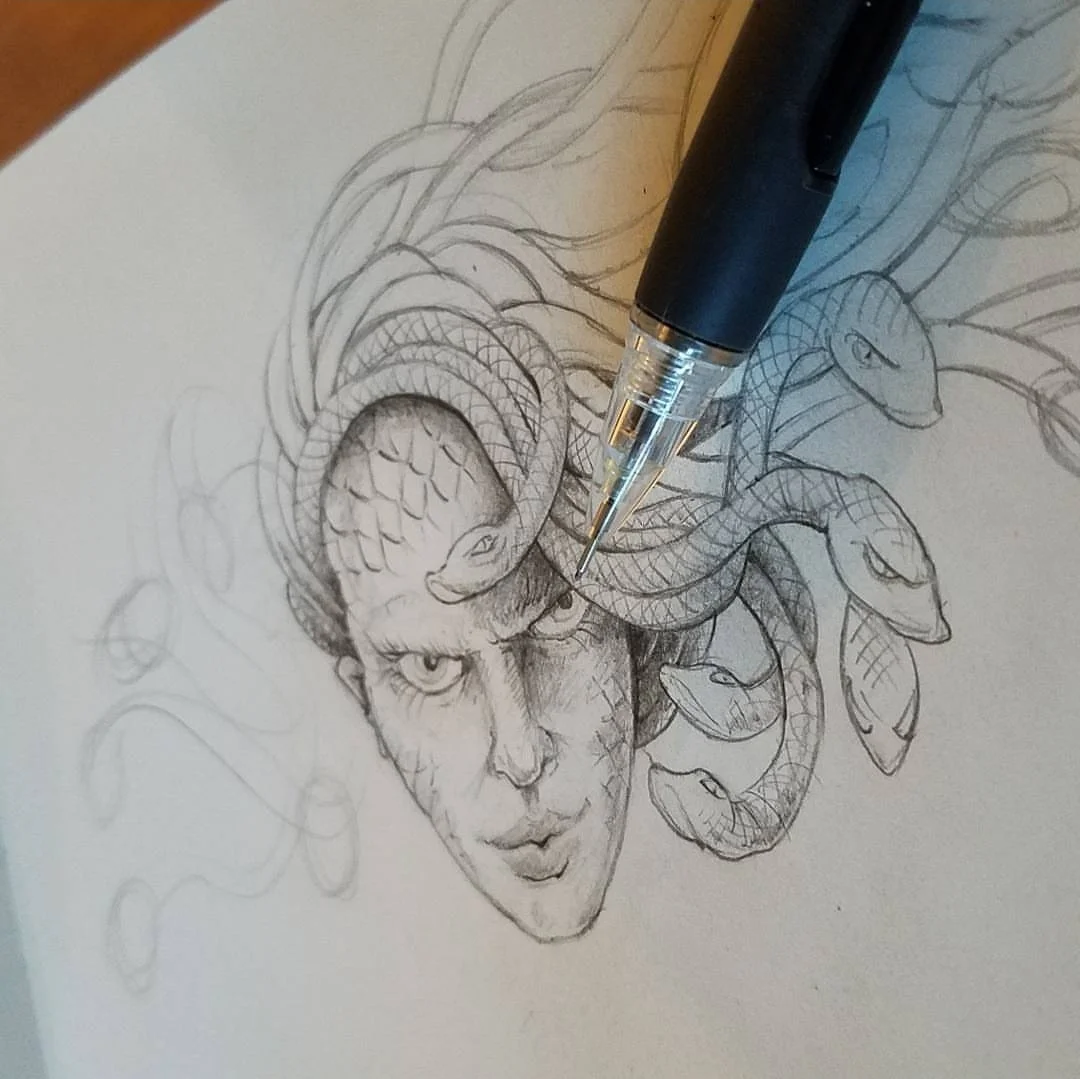 Sketch of a woman's face with hair made of snakes, resembling Medusa, with detailed facial features and snake scales.