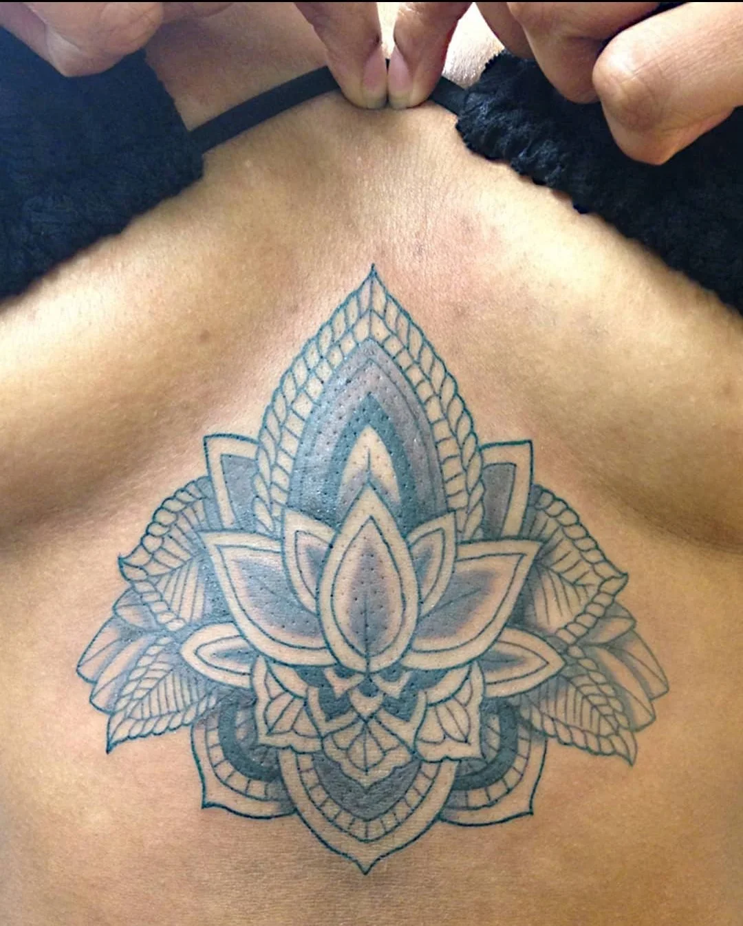 House of ink Tattoo Description: Sternum Tattoo, Black And Gray, Fineline, Mandala