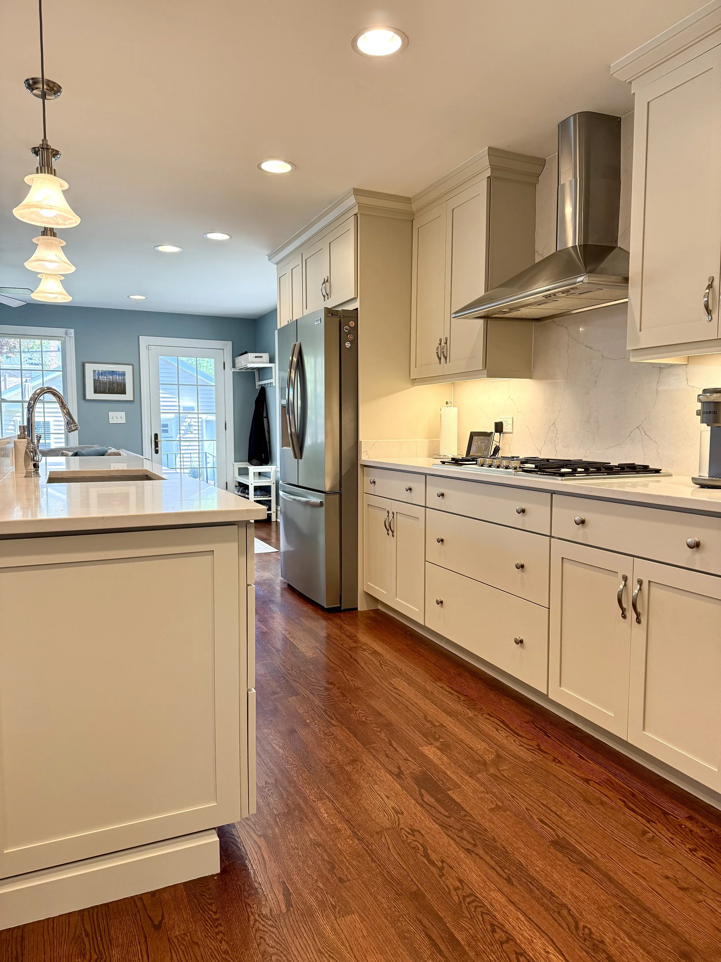 Freshly painted kitchen cabinets with updated hardware in a modern Chicago home.