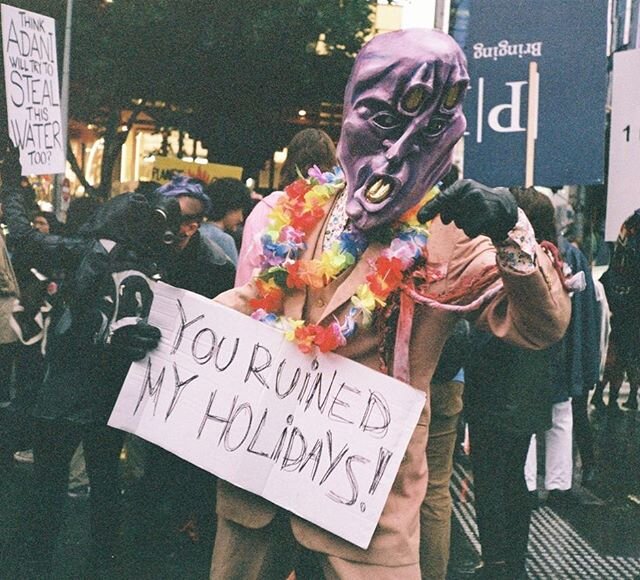 This picture was taken in a climate change protest in Melbourne a few months back (bush fire season). It&rsquo;s a call to prime minister Scott Morrison (Scomo) because he was in Hawaii on holiday when the bushfires happened and didn&rsquo;t come bac