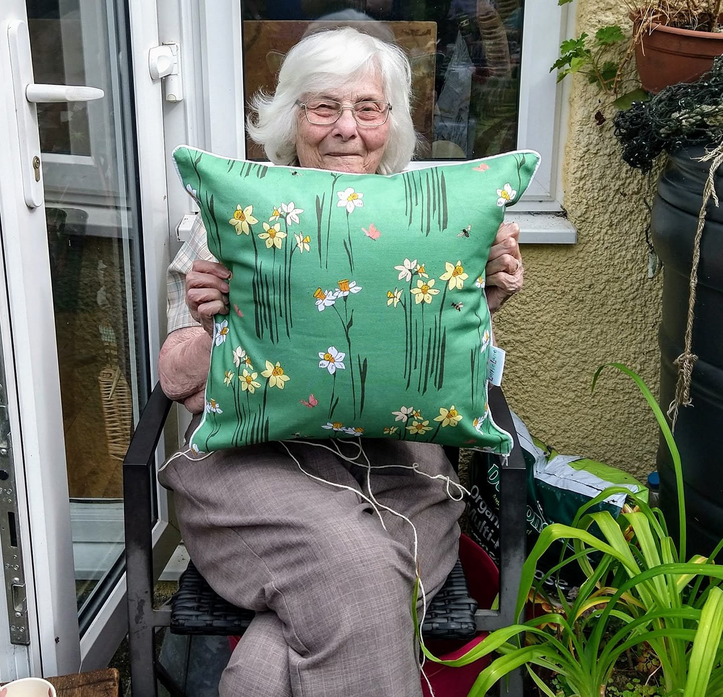 Granny and her Daffodil cushion.jpeg