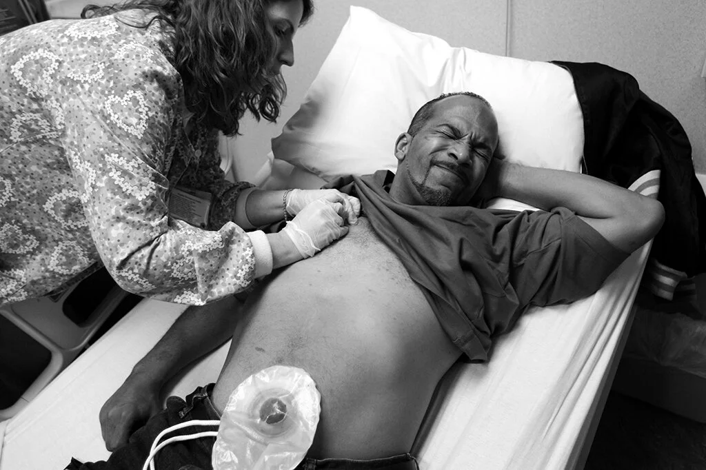  Lloyd Byron Martell, 41, of Detroit, grimaces as the nurse hooks up his port to receive chemo treatment in the Cancer Treatment Center at Oakwood Hospital Medical Center, in Dearborn, Mich., Wednesday, Nov. 8, 2006.  