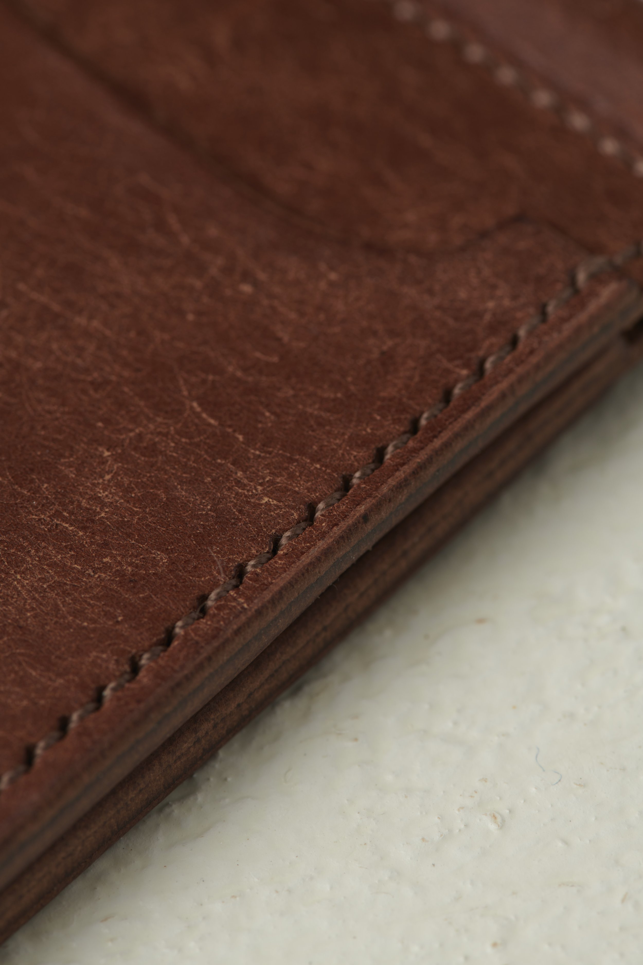 detail shot of stitching on money clip card holder