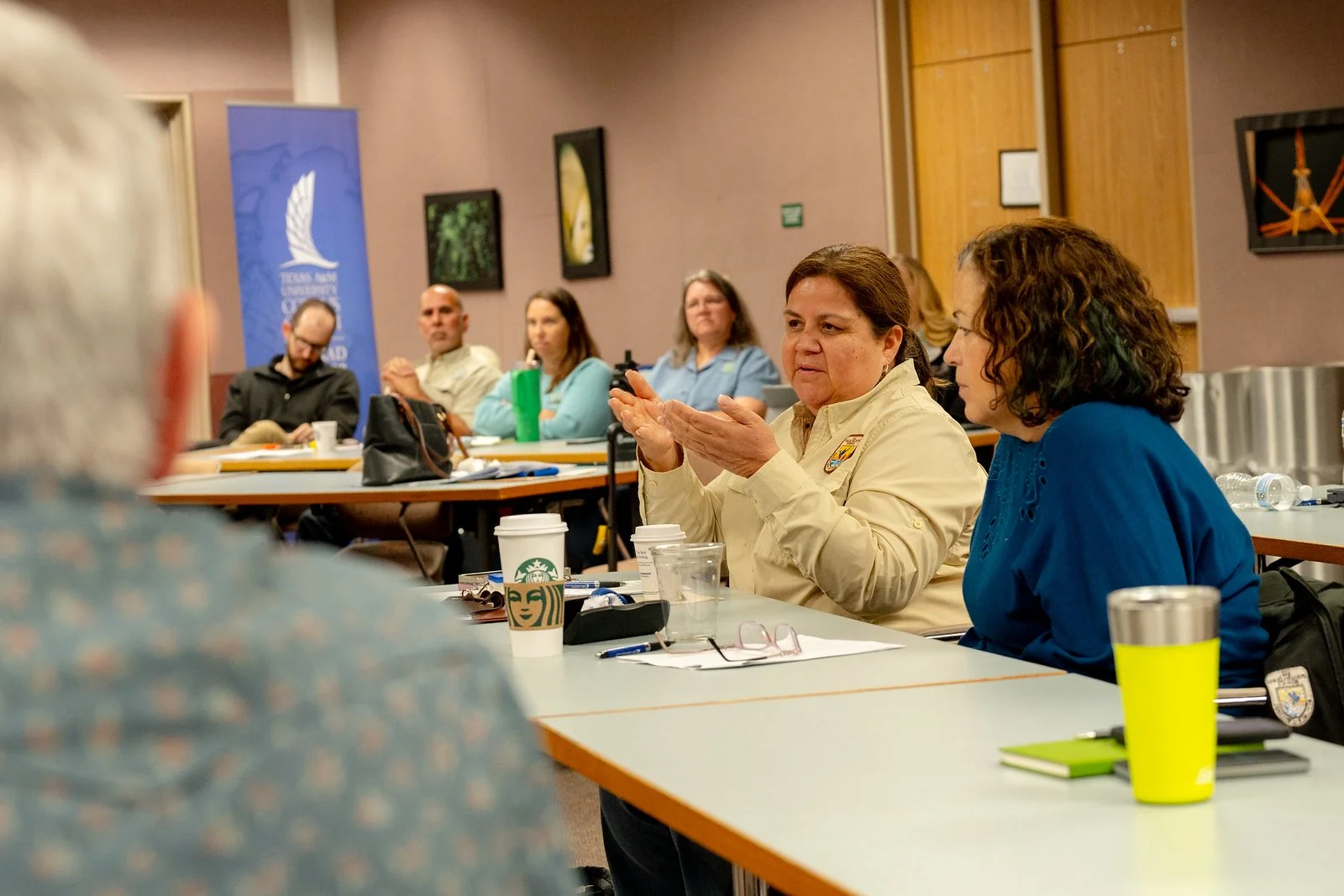 TCRC meeting attendees discuss agenda items.