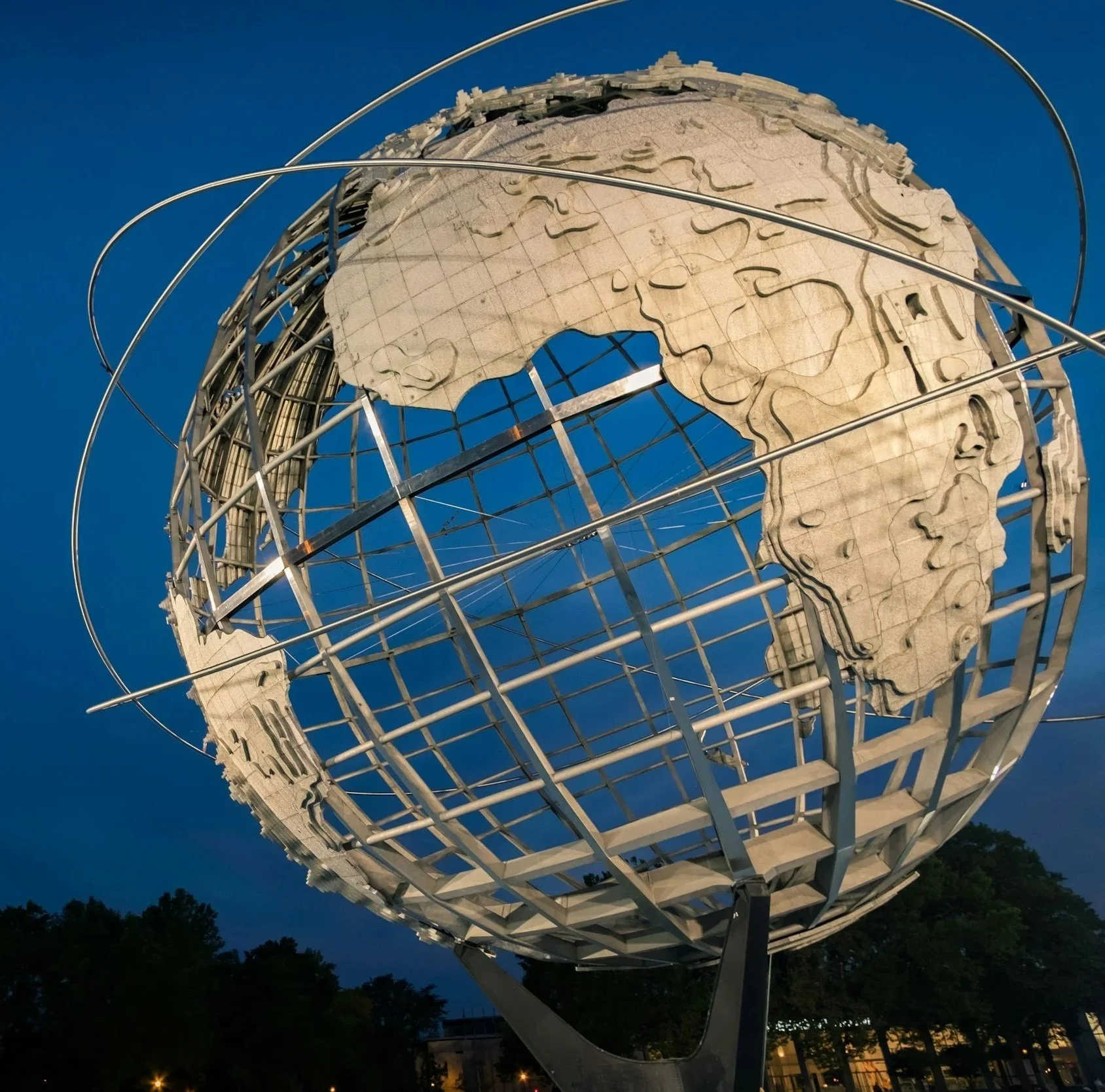 Globe shaped with a grid and continent shapes attached to the grid.