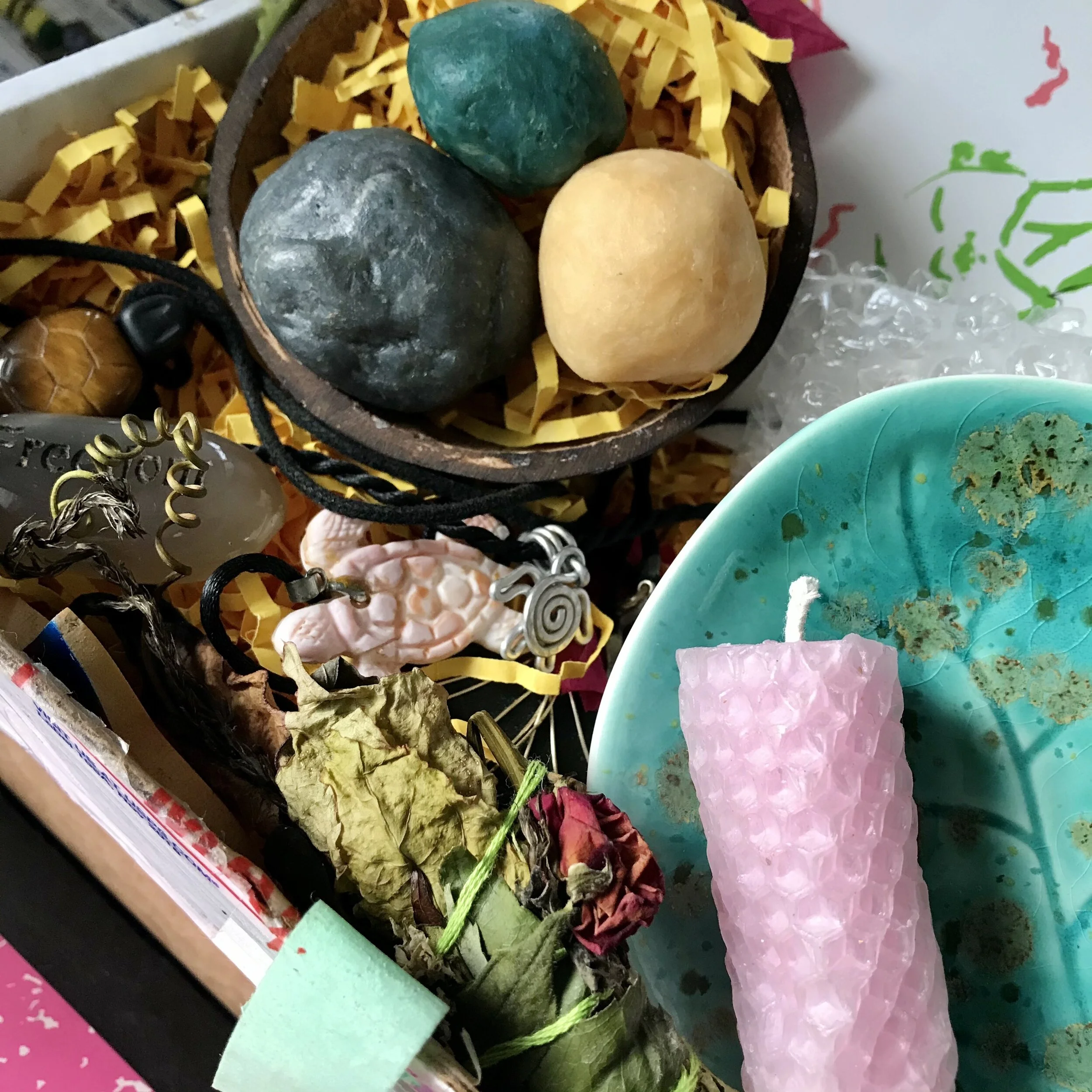 Holiday 2020 Box (from left to right): Coconut Soaps in Charcoal, Sandalwood, and Original), Hand-etched Conch Shell Turtle Necklace or Metal Vortex Turtle Necklace, Smudge Stick in Rosemary, Roses, and Passionfruit blend, Ceramic Sea Grape All-purp…