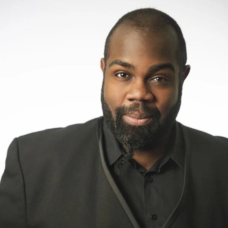 Reginald Mobley “It must be said from the beginning that one of the joys of seeing Mobley is hearing his beautiful alto coming out of a big, tall man who looks more like a linebacker for the Miami Dolphins than the P.G. Wodehouse party guest his name might suggest.” Countertenor Reginald L. Mobley fully intended to speak his art through watercolors and oil pastels until circumstance demanded that his own voice should speak for itself. Since reducing his visual color palette to the black and white of a score, he’s endeavored to open up a wider spectrum onstage. After starting his classical music career as a member of twice GRAMMY® nominated ensemble Seraphic Fire, Reggie has since appeared with Academy of Ancient Music, Agave Baroque, Bach Collegium San Diego, Calgary Symphony, Monteverdi Choir & English Baroque Soloists, Pacific Music Works, the Royal Scottish National Orchestra, Seattle Symphony, TENET, and The Handel + Haydn Society. With the latter, he had the honor of becoming the first Black person to lead H+H in its Bicentennial year. Recent festival appearances include Bachfest Leipzig, Festival Berlioz, Early Music Vancouver, Thüringer Bachwoche, Portland Bach Experience, and the Boston Early Music Festival. This coming season will see debut appearances with St. Paul Chamber Orchestra, Philharmonia Baroque, Musica Angelica, Bach Akademie Stuttgart, Gaechinger Cantorey, Chicago’s Music of the Baroque, and a recital of the music of Black American composers with keyboardist Henry Lebedinsky at the Musée d'Orsay in Paris . Reggie has also participated this fall in two new recording projects. An all Handel disc featuring the Ode to the Birthday of Queen Anne, and the Utrecht Te Deum & Jubilate with Bach Akademie Stuttgart led by Hans Christoph Rademann, and Italian Chamber Duets of Agostino Steffani led by harpsichordist, Jory Vinikour. Never bound by conventional countertenor repertoire, Reggie has a fair bit of non-classical work in tow. His first professional work was in Musical Theatre, and while working in Japan (as a Singer/Actor for Tokyo Disney), he performed cabaret shows of gospel, jazz, and torch songs in jazz clubs around Tokyo. Since moving in Boston, a strong devotion to social and political activism has awoken and become a part of everyday life. As a member of NoBoston2024 and allied with No Boston Olympics, Reggie (one of the #tenpeopleontwitter) was able to lend his strength to the effort to reject the 2024 Olympic Games bid that was “awarded” to Boston. That, and time volunteering in local political campaigns, has only helped focus a desire to make a difference within the Arts. Particularly with the massive inequality regarding race, gender, and sexuality within the classical music industry.