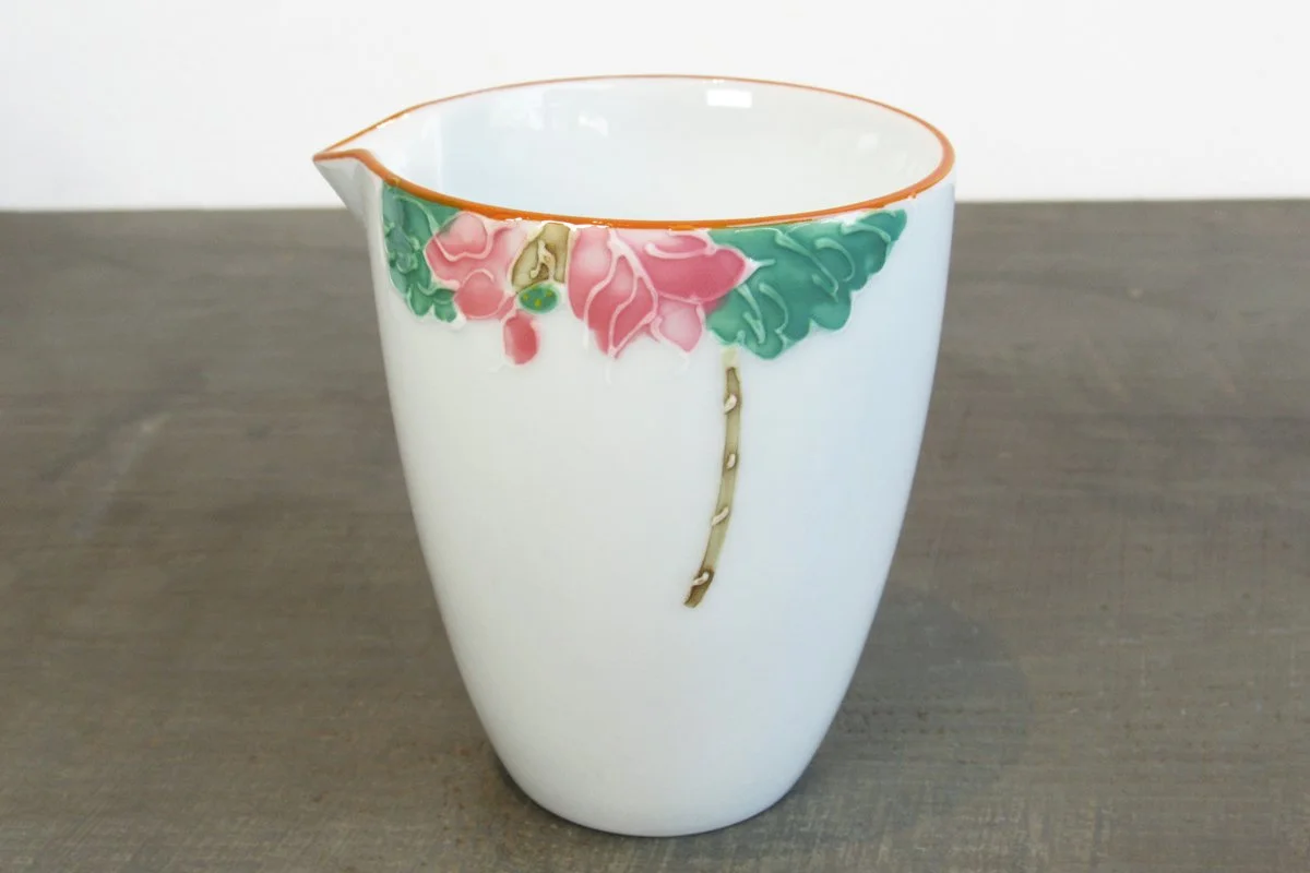 White tea pitcher (gong dao bei) with a hand-painted pink lotus flower design