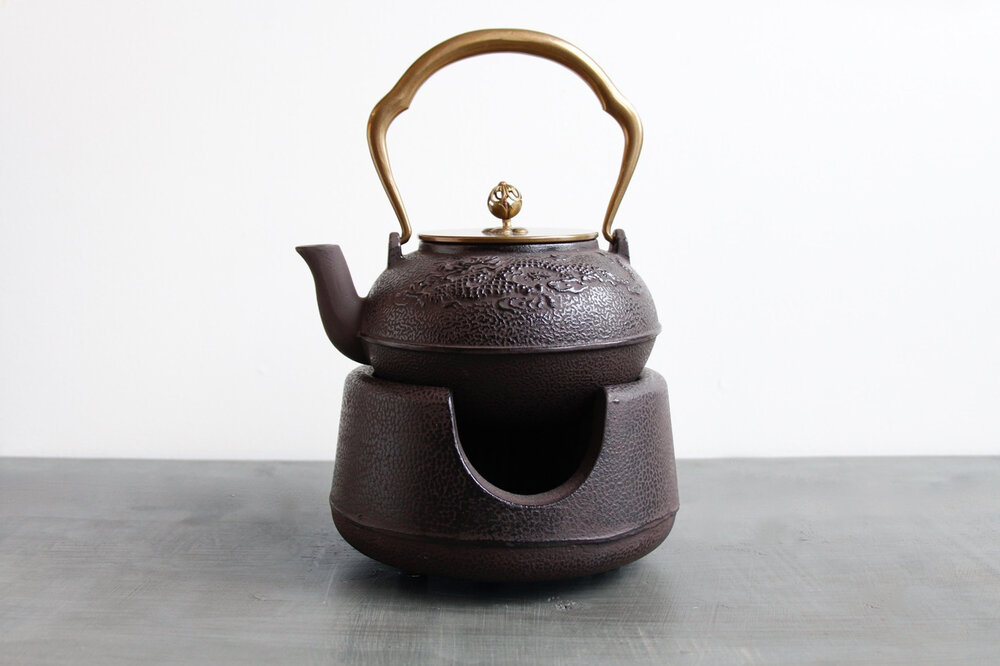 https://images.squarespace-cdn.com/content/v1/5d5f0a524a0fbf000138ebe7/1580688041216-77CHP0JHH12VMDG8OMWD/raw-iron-antique-dragon-teapot-with-tea-warmer.jpg?format=1000w