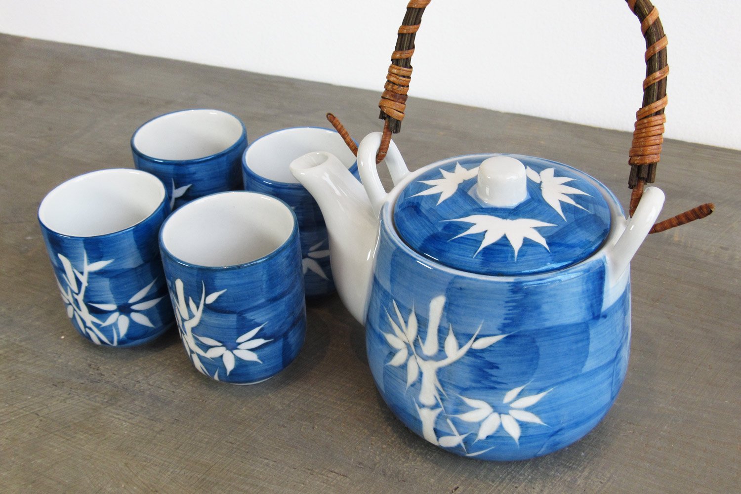 5-piece blue tea set with a pattern of white bamboo stalks and leaves