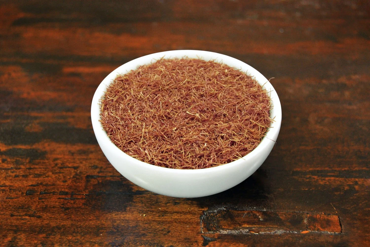 Loose cornsilk tea in a white tea bowl