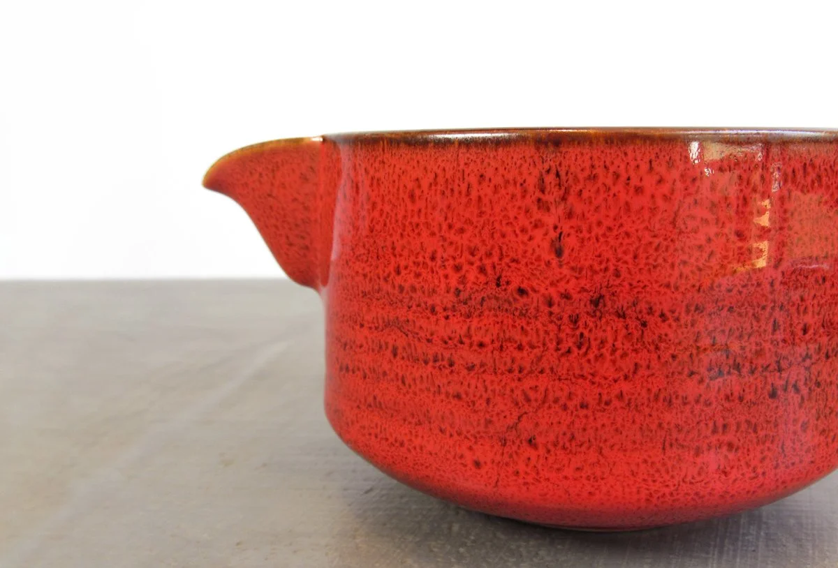 Side view of red spouted matcha bowl