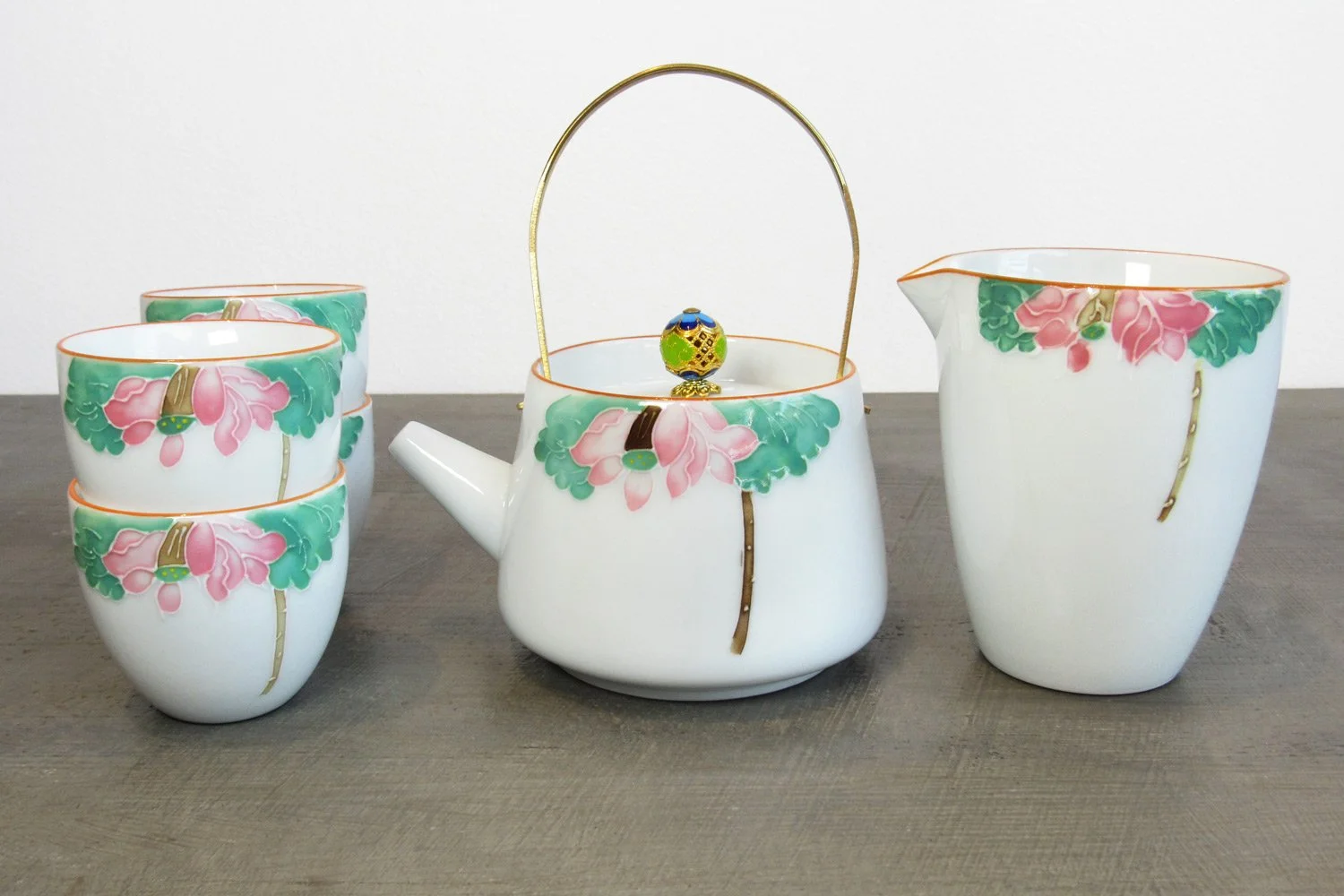 lotus flower tea set with a teapot, four teacups, and a tea pitcher called a gong dao bei