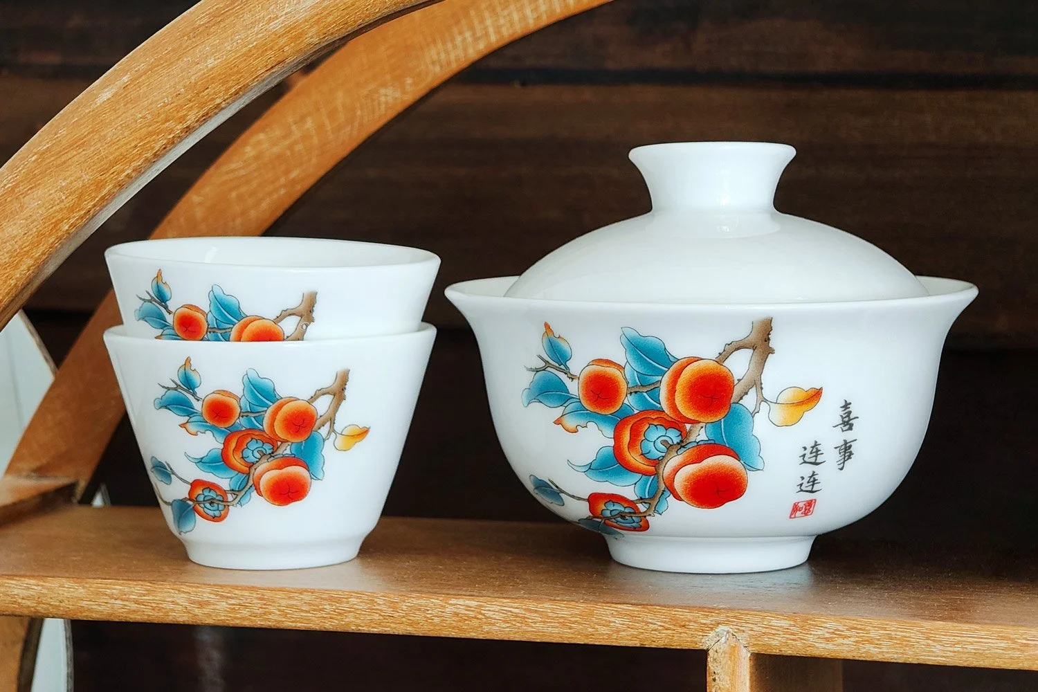 3-piece persimmon branch gaiwan set on a wooden shelf