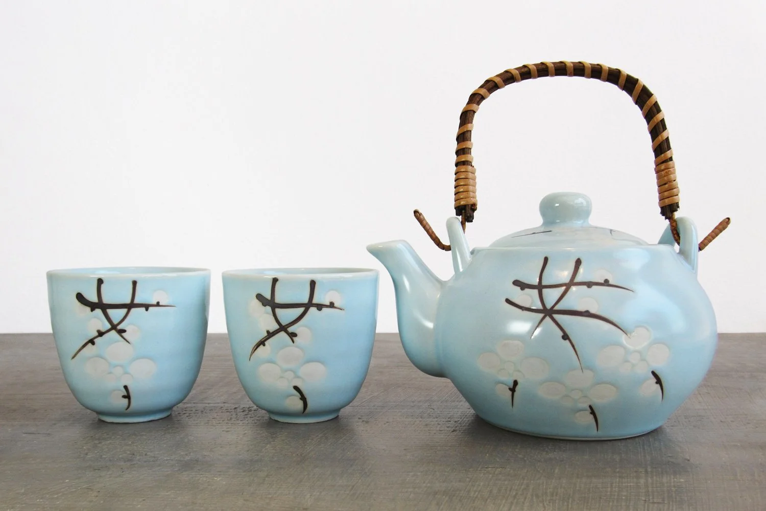 3-piece light blue glaze tea set with a design of white blossoms and branches