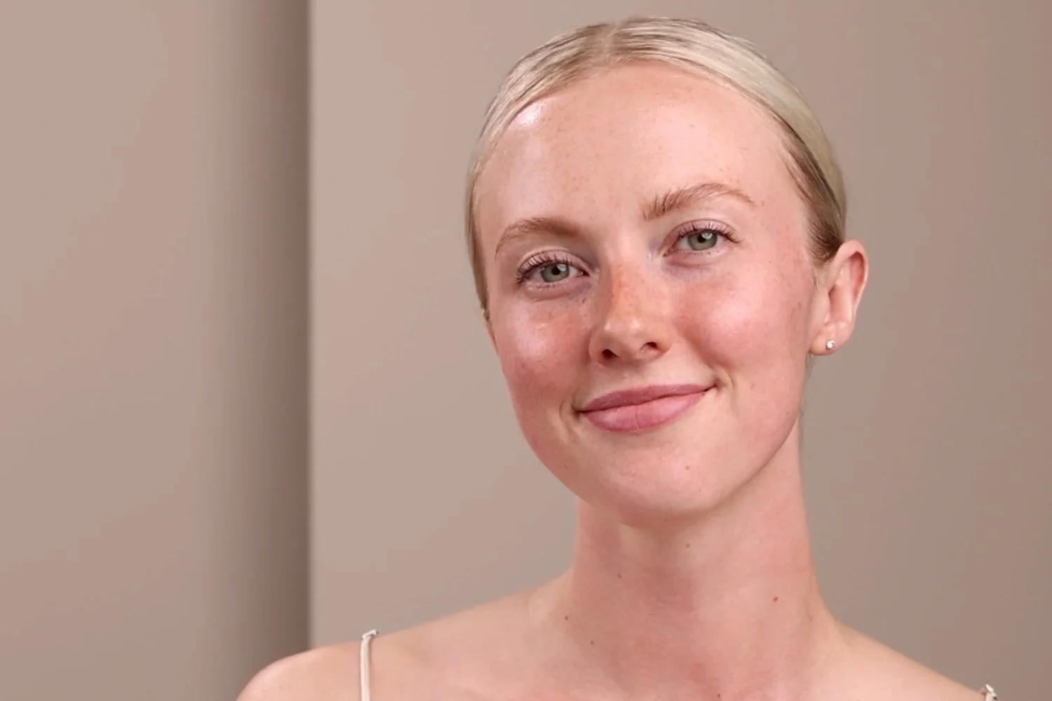 A woman with the Marine Flower Peptide Serum applied on her face