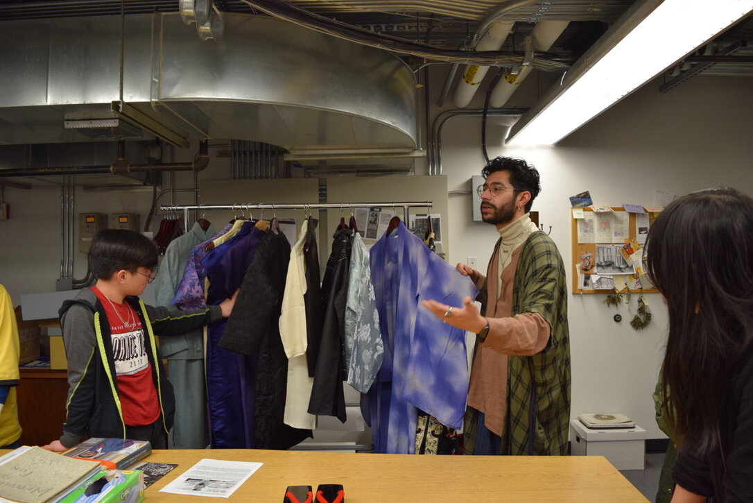  Students study and interact with garments from the Wing Luke Collection.  