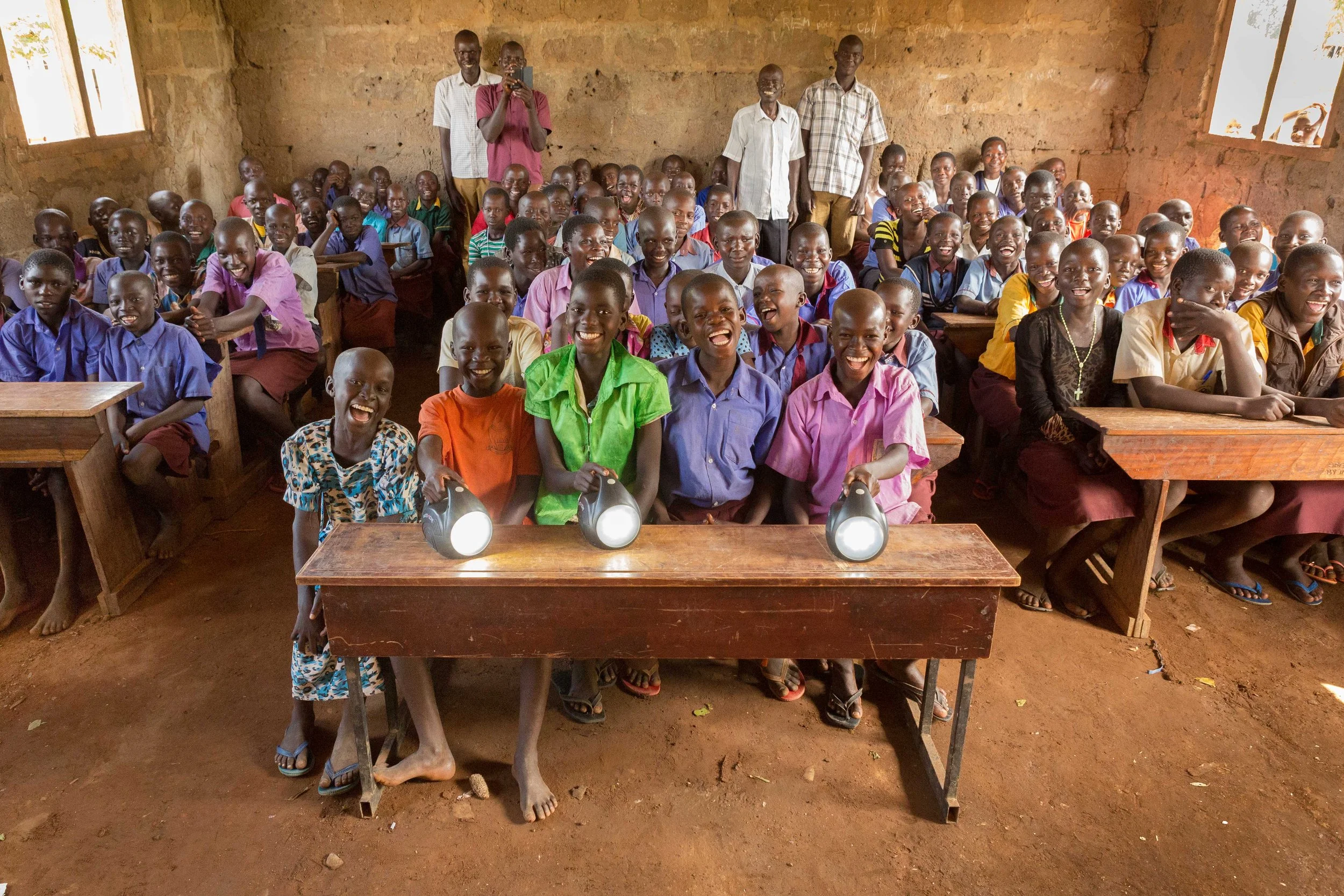 kids in desk with solar light.JPG