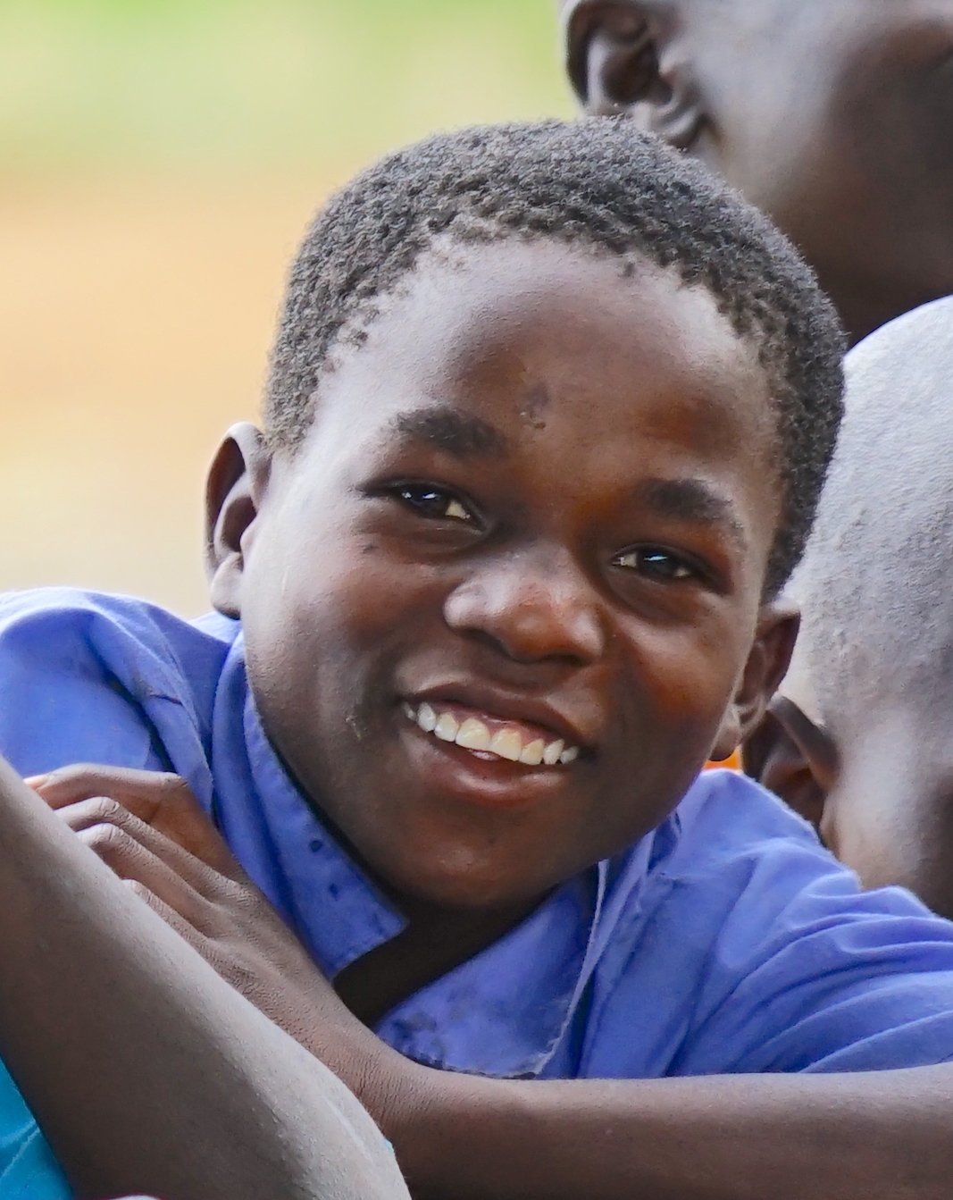 eog awila boy smiling in desk.jpeg