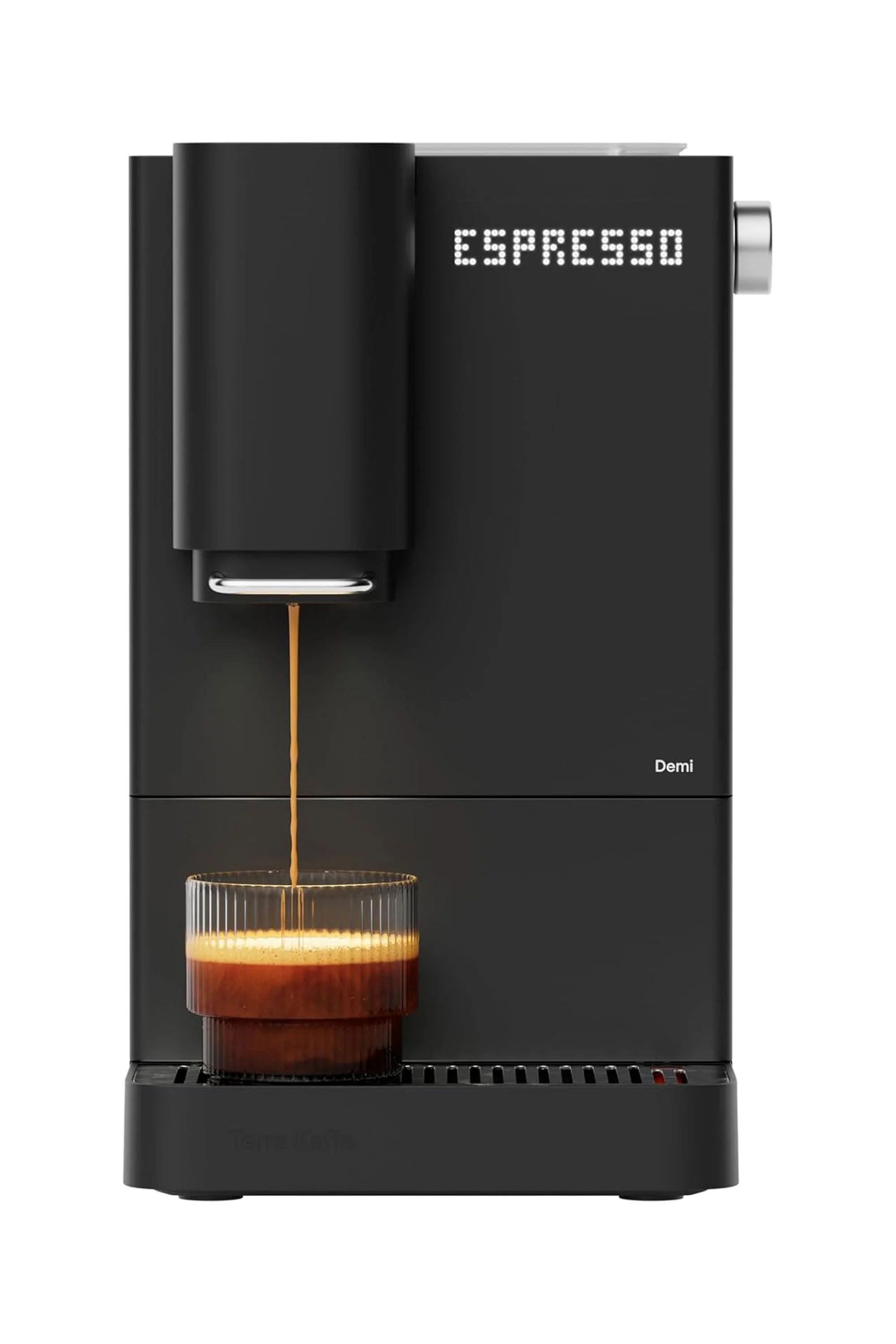 A black espresso machine brewing coffee into a glass cup. The machine displays 'ESPRESSO' on a digital screen.