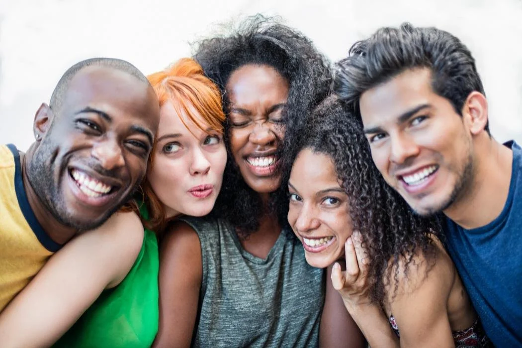 Diverse group of friends smiling representing the range of adults served by neurodiversity affirming therapy and evaluations at True Reflections Mental Health Services in Middlesex NJ