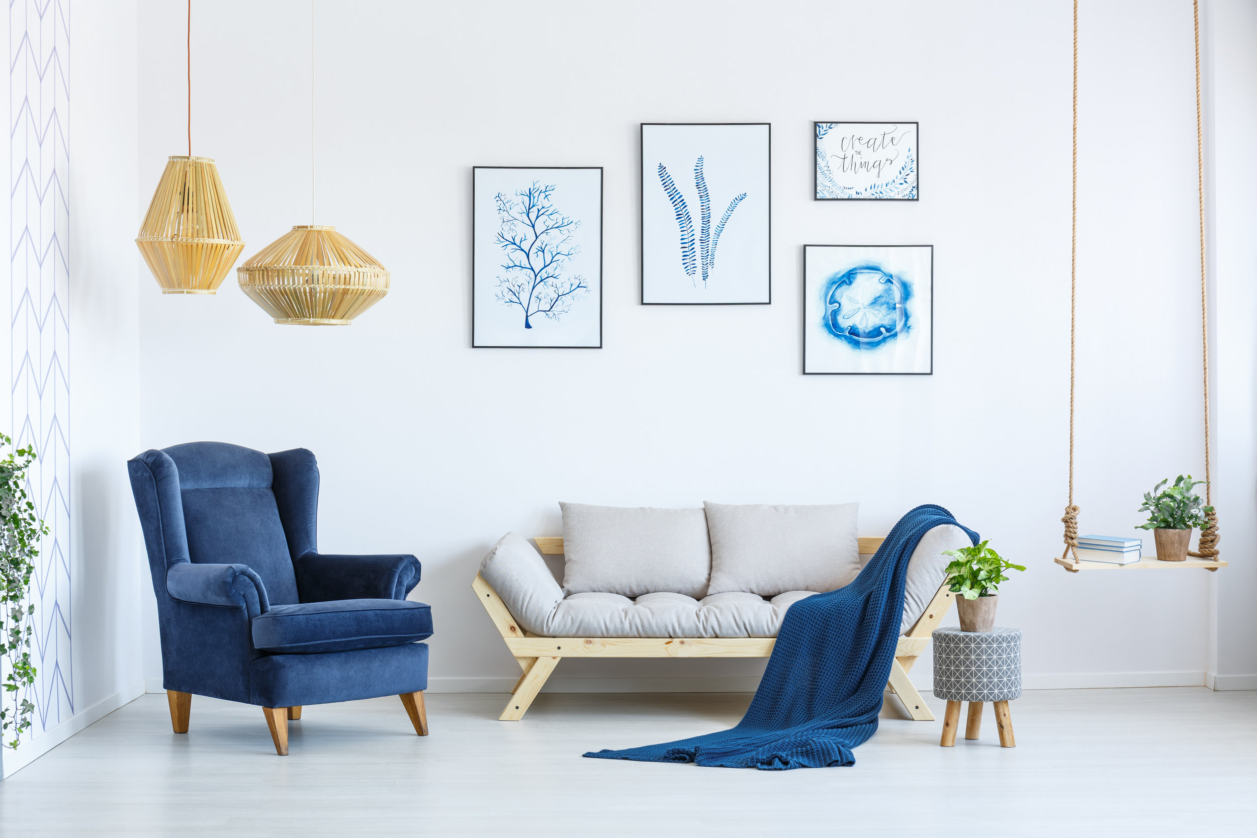 white living room with blue chair and accents