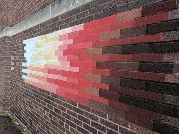  Handmade paper couched brick by brick on the exterior wall of Zanesville Ohio school. 