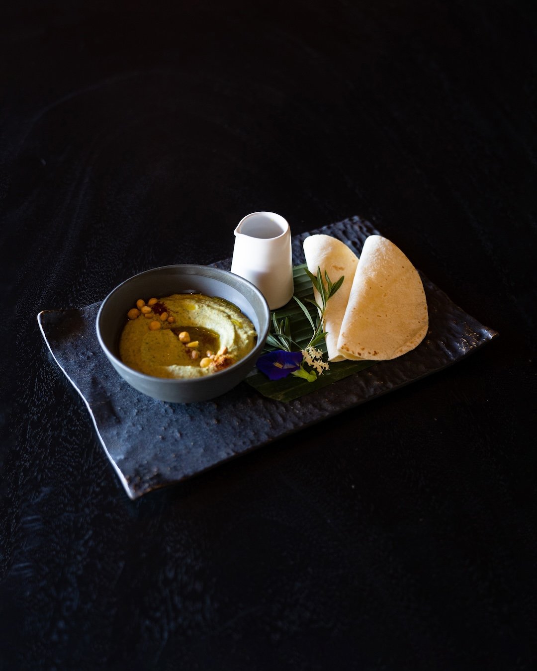 Taste a burst of flavors with our Eshab Alhadika starter! Green hummus seasoned with Baharati spice, topped with pine nuts, drizzled with olive oil and served with grilled rye bread. Such a delight! 🌿🍞 #VegetarianTreat

ESHAB ALHADIKA
As Lunch Star