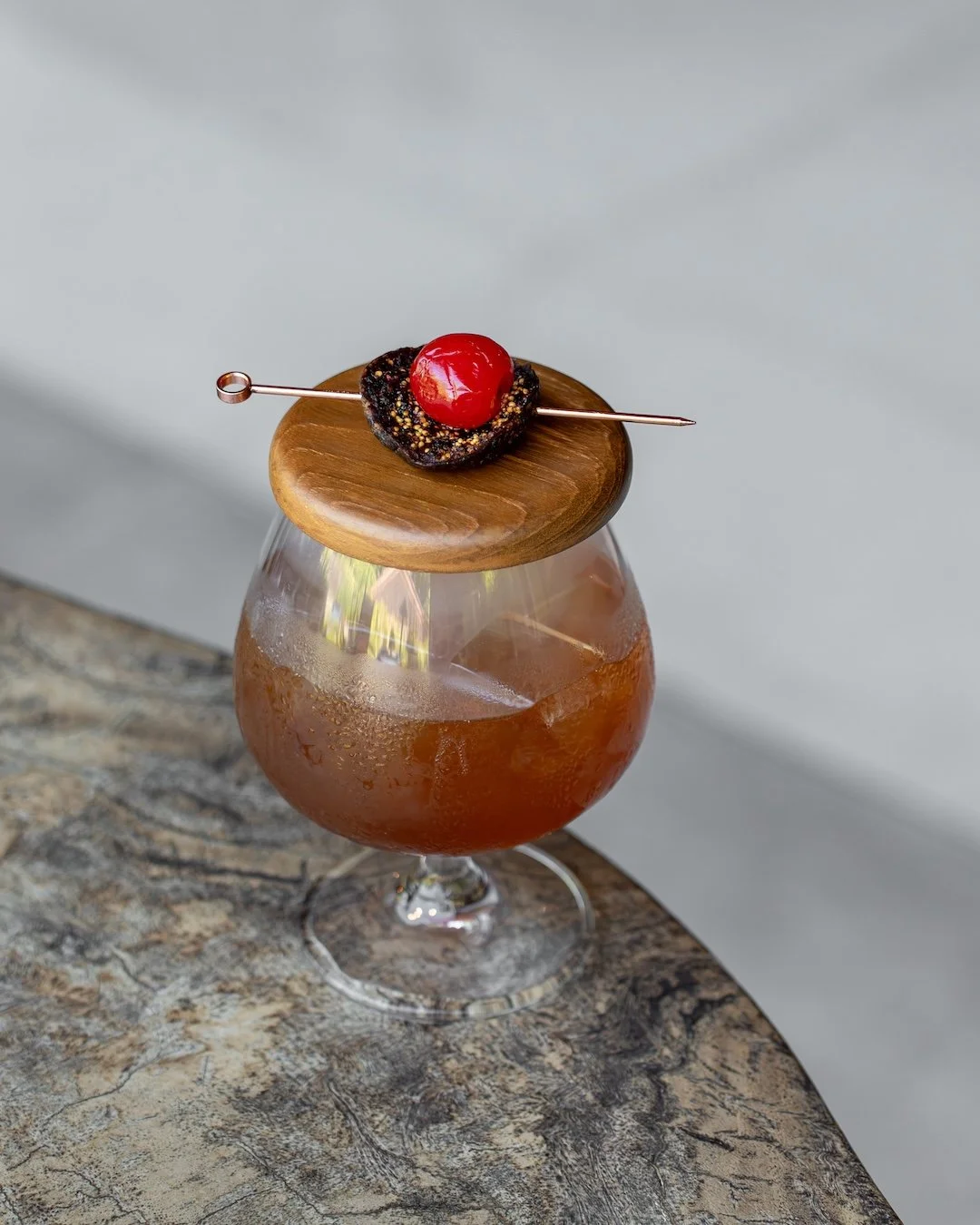 Deep, warm, and just the right amount of bitter.

Fig-infused bourbon meets red vermouth, Cynar, and a touch of bitter cinnamon cordial &mdash; a slow-sipping cocktail with layers that reveal themselves one sip at a time.

AMARO. Best enjoyed slowly,