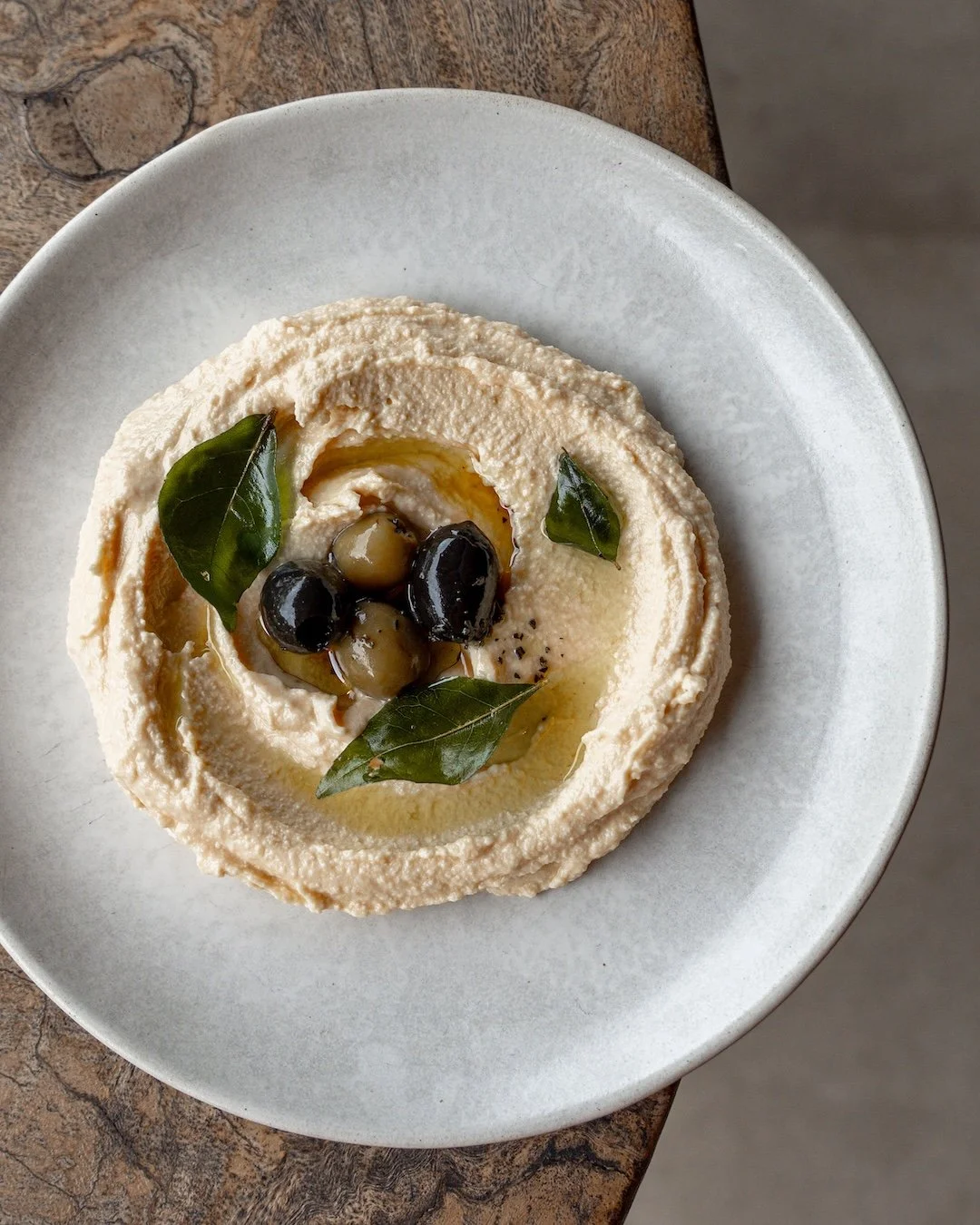 Long before it became a favorite on menus around the world, hummus was a staple across the Middle East, where chickpeas, tahini, lemon, and garlic came together in a dish made for sharing. Its exact origins remain debated, but its place at the table 
