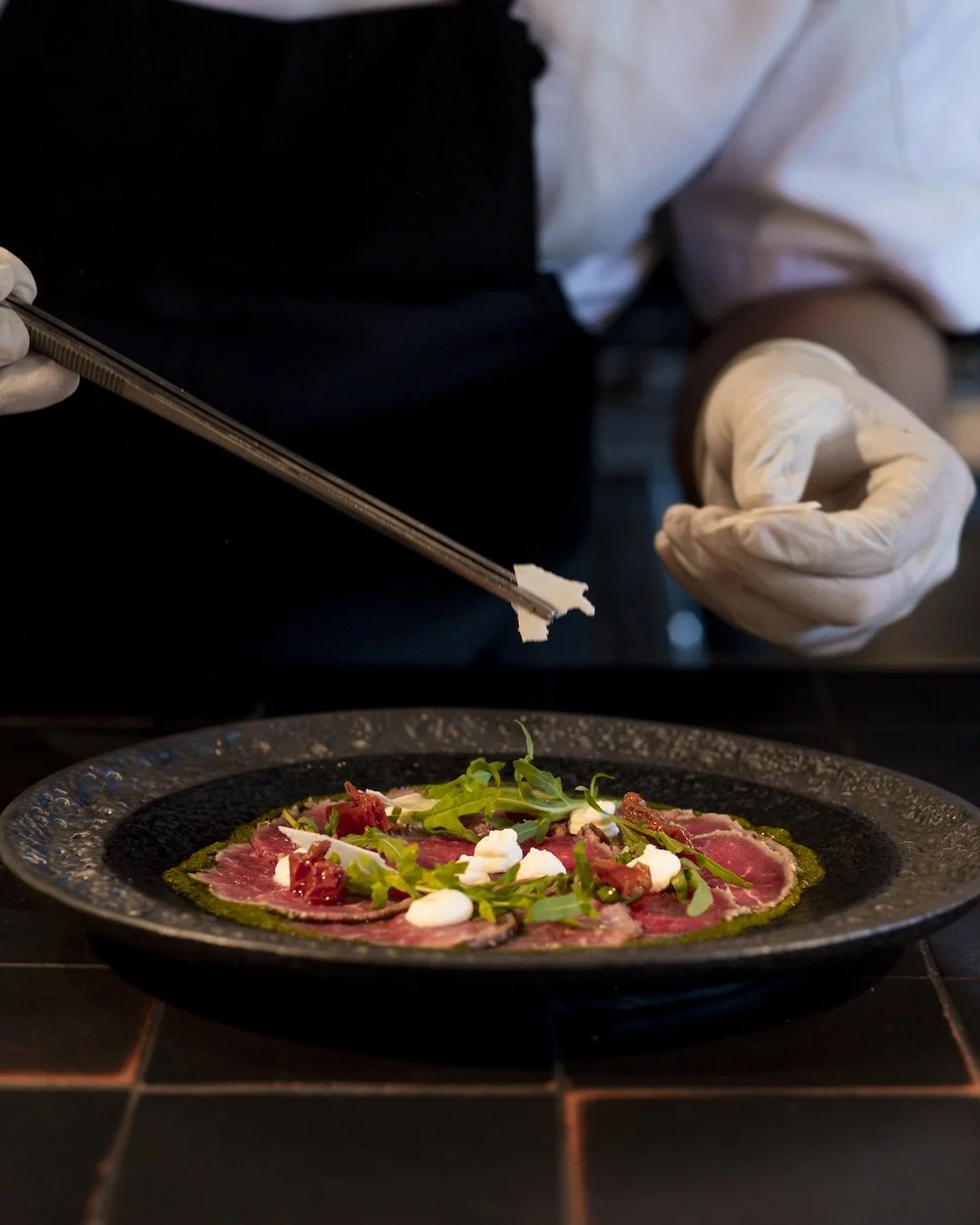 plating wagyu tenderloin carpaccio in ubud