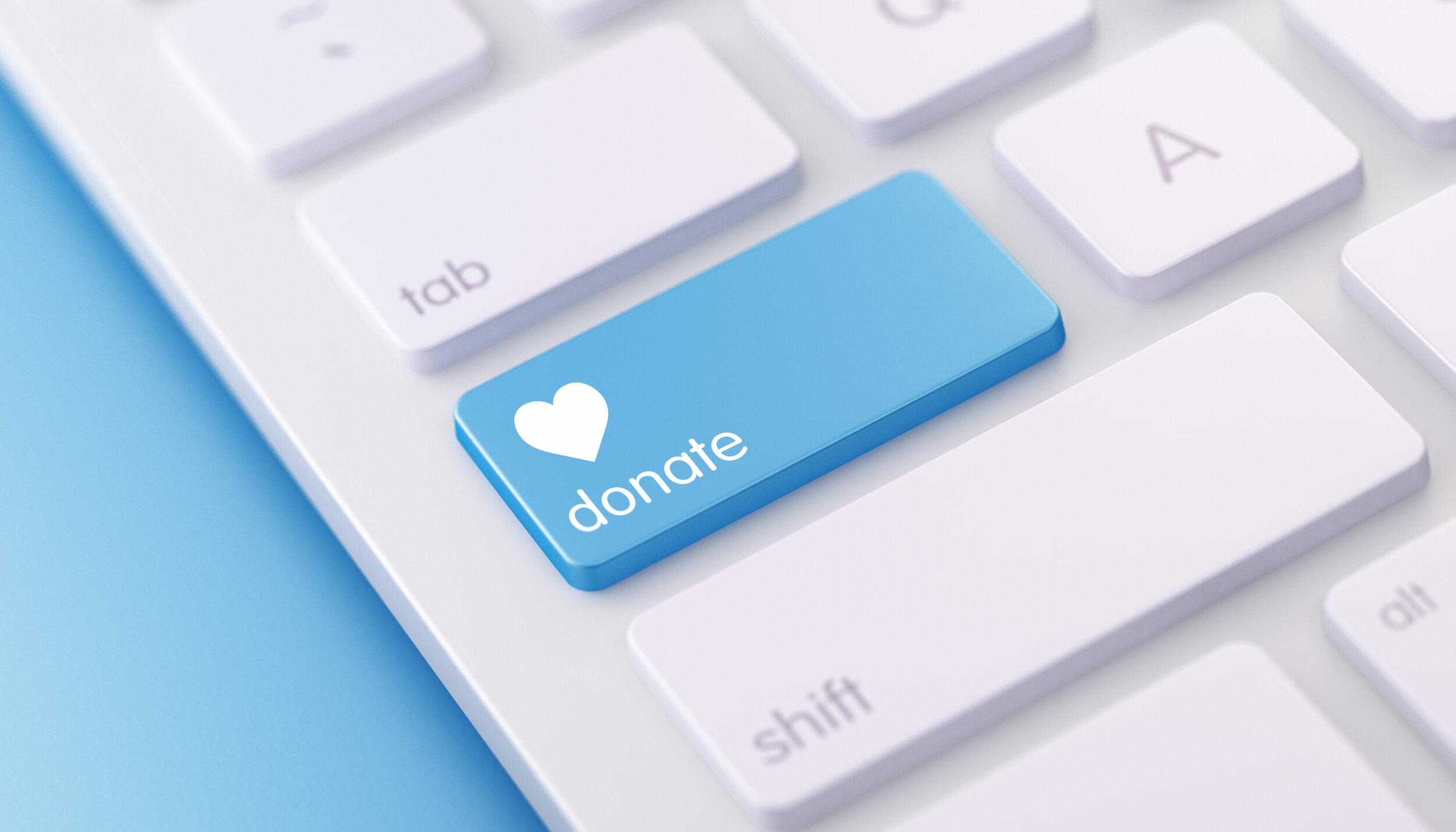  image of a portion of a computer keyboard with a blue button that is labeled DONATE 