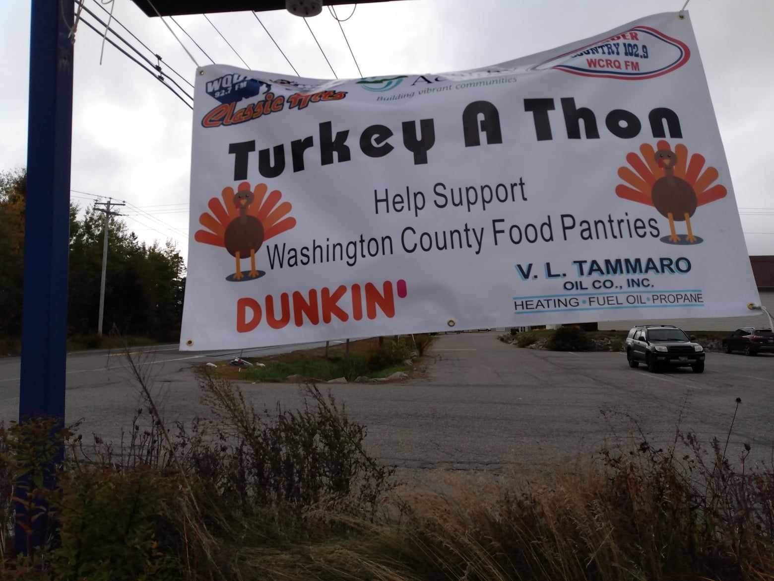  A large vinyl banner advertising the Washington County Turkey-A-Thon hangs from the roadside sign at Four Corners Shop ‘n’ Save in Columbia. 