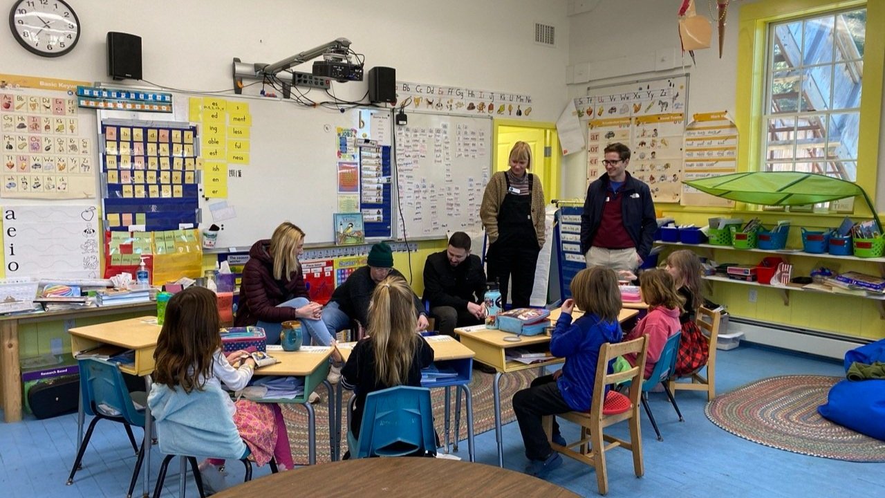 AHEC students interacting with students in a preschool classroom.