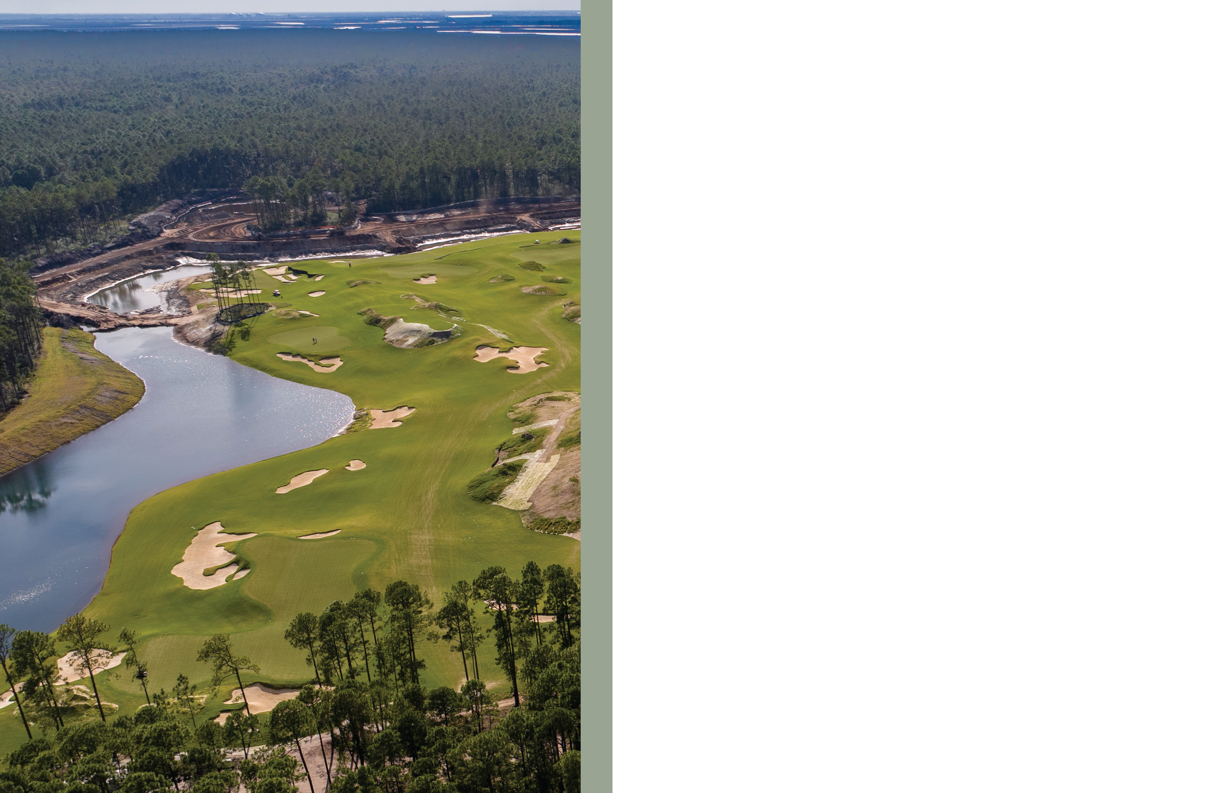 Aerial view of a golf course with green fairways, sand traps, water hazards, surrounded by trees, and a construction site at the edge of a forest in the background.