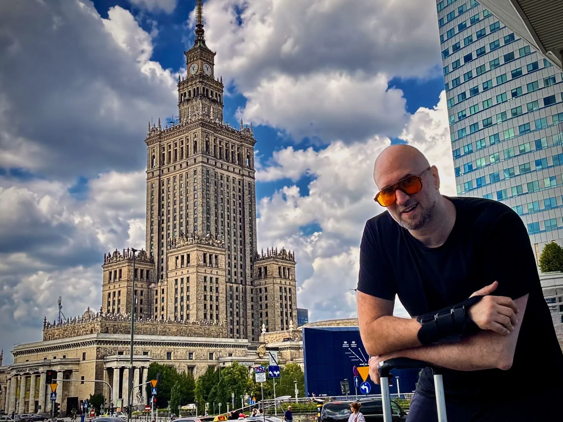 Paul Korona Dyer in Warsaw, the Palace of Culture and Science behind him.