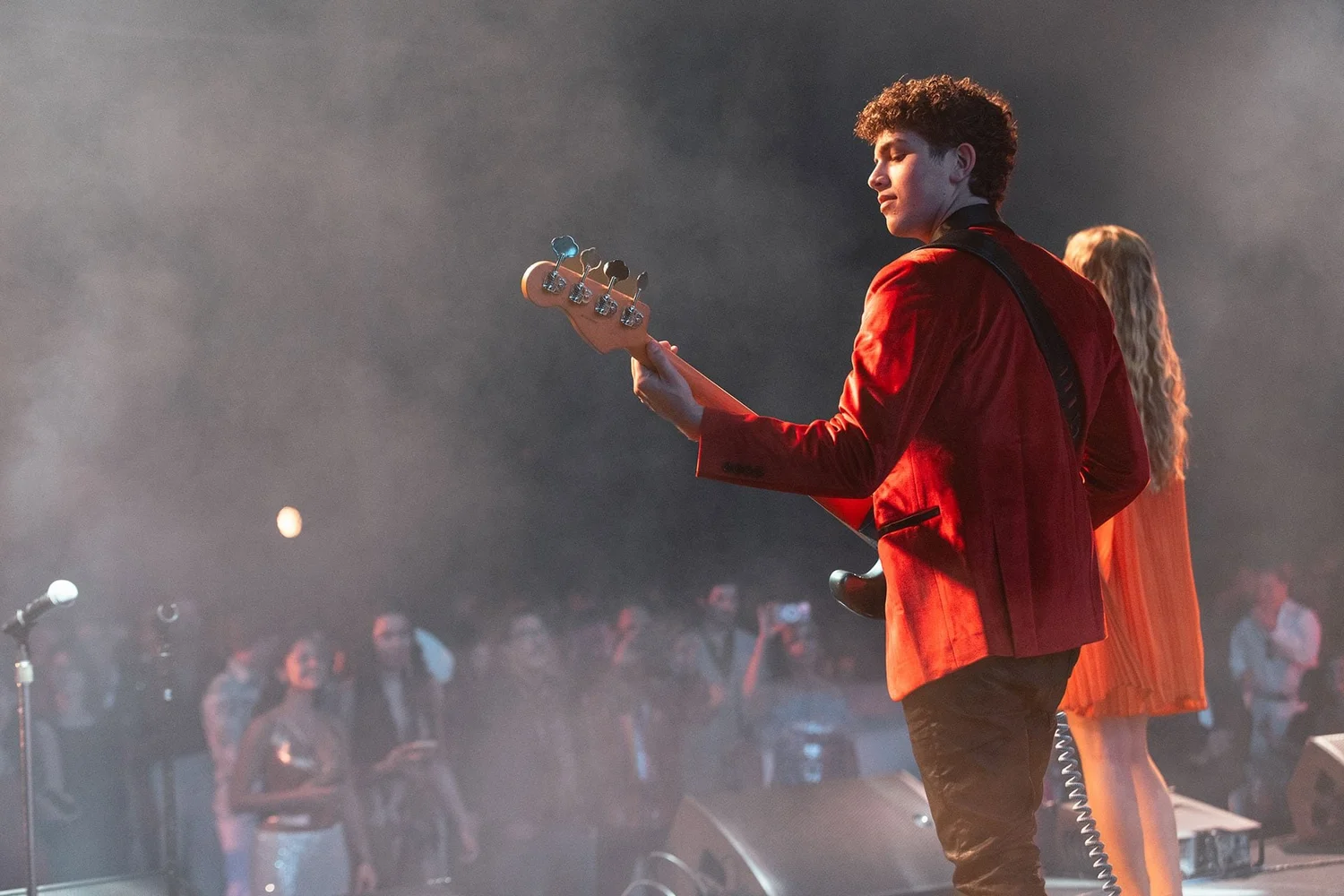 YMU student guitarist performing on stage