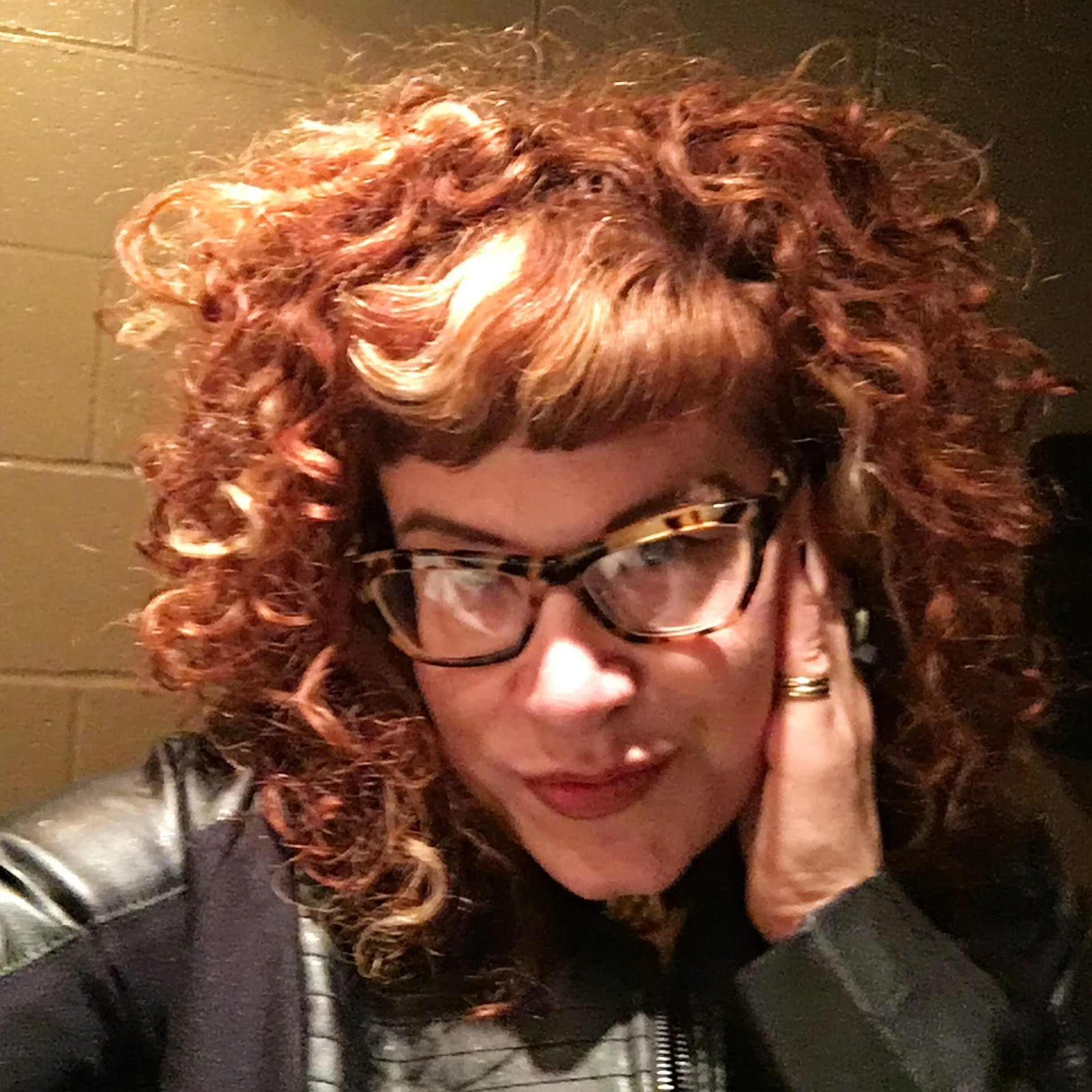   This is a photo of Leah Spurrier that is behind the scenes at a show in Brooklyn New York. 