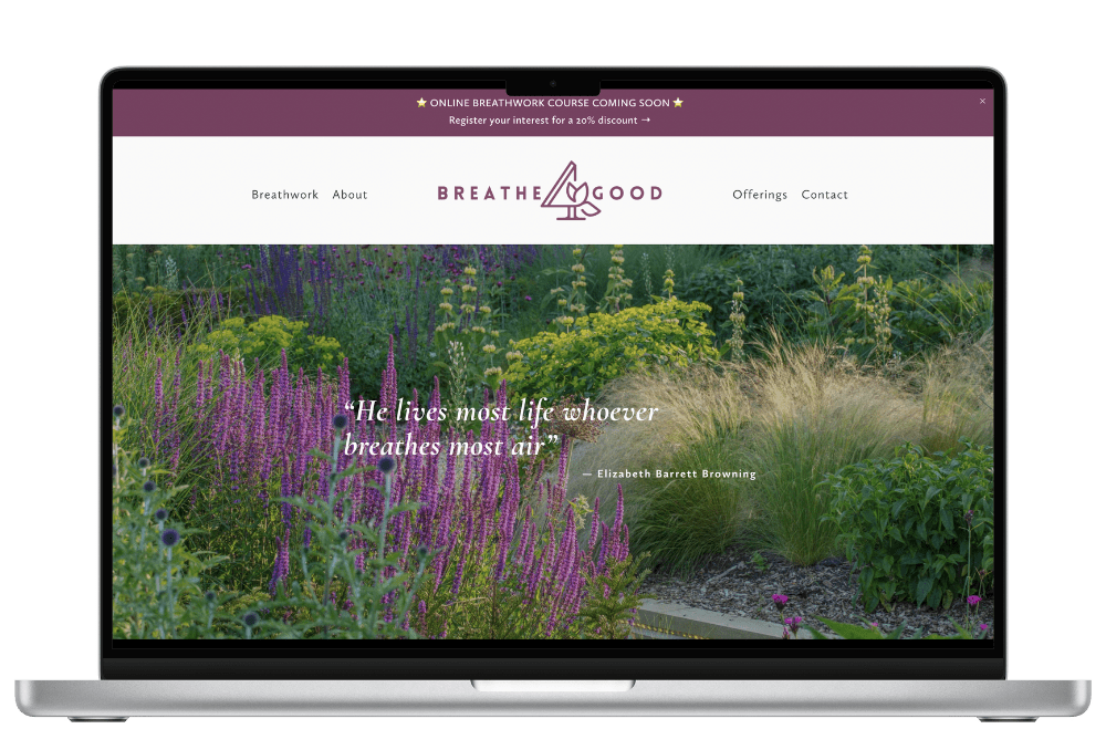 A laptop screen displaying a website for 'Breathe Good' with a nature-themed background featuring greenery and purple flowers. The website header includes menu options like Breathwork, About, Offerings, and Contact. A quote by Elizabeth Barrett Browning is displayed over the image: 'He lives most life whoever breathes most air.' There is an announcement about an online breathwork course with a discount offer.