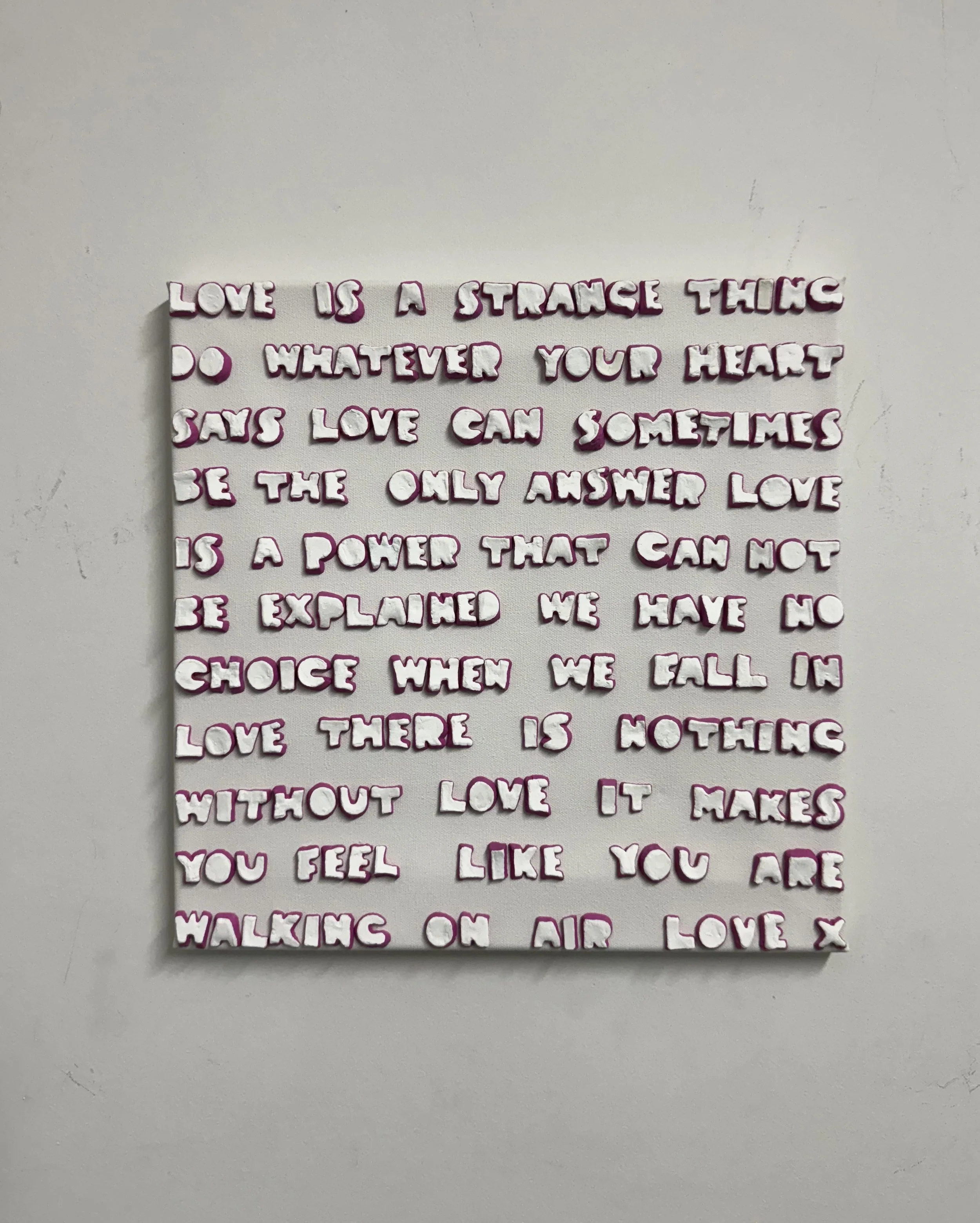 love is a strange thing on wall.jpg