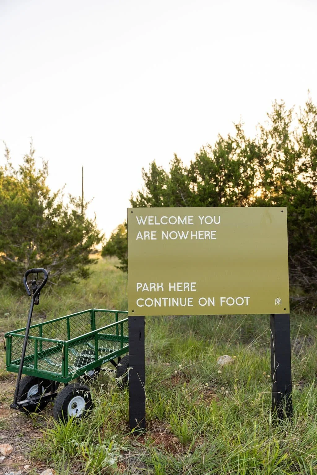 Welcome sign at NowHere nature cabin retreat