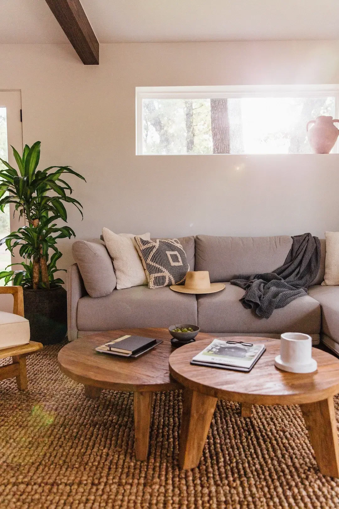 nowhere-hammock-lodge-living-room-sofa-wooden-tables.webp