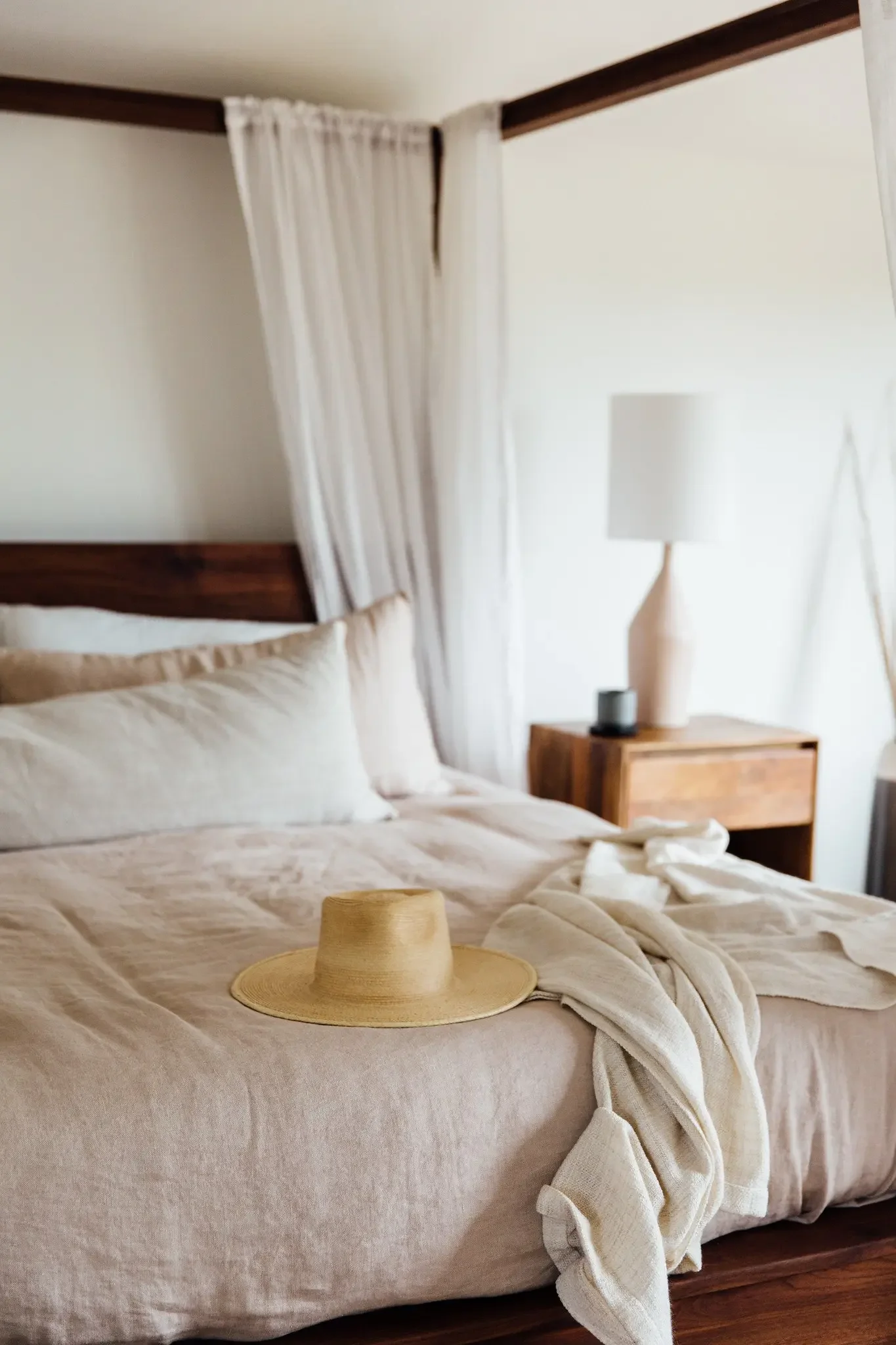 nowhere-hammock-lodge-bed-straw-hat-linen-blanket.webp