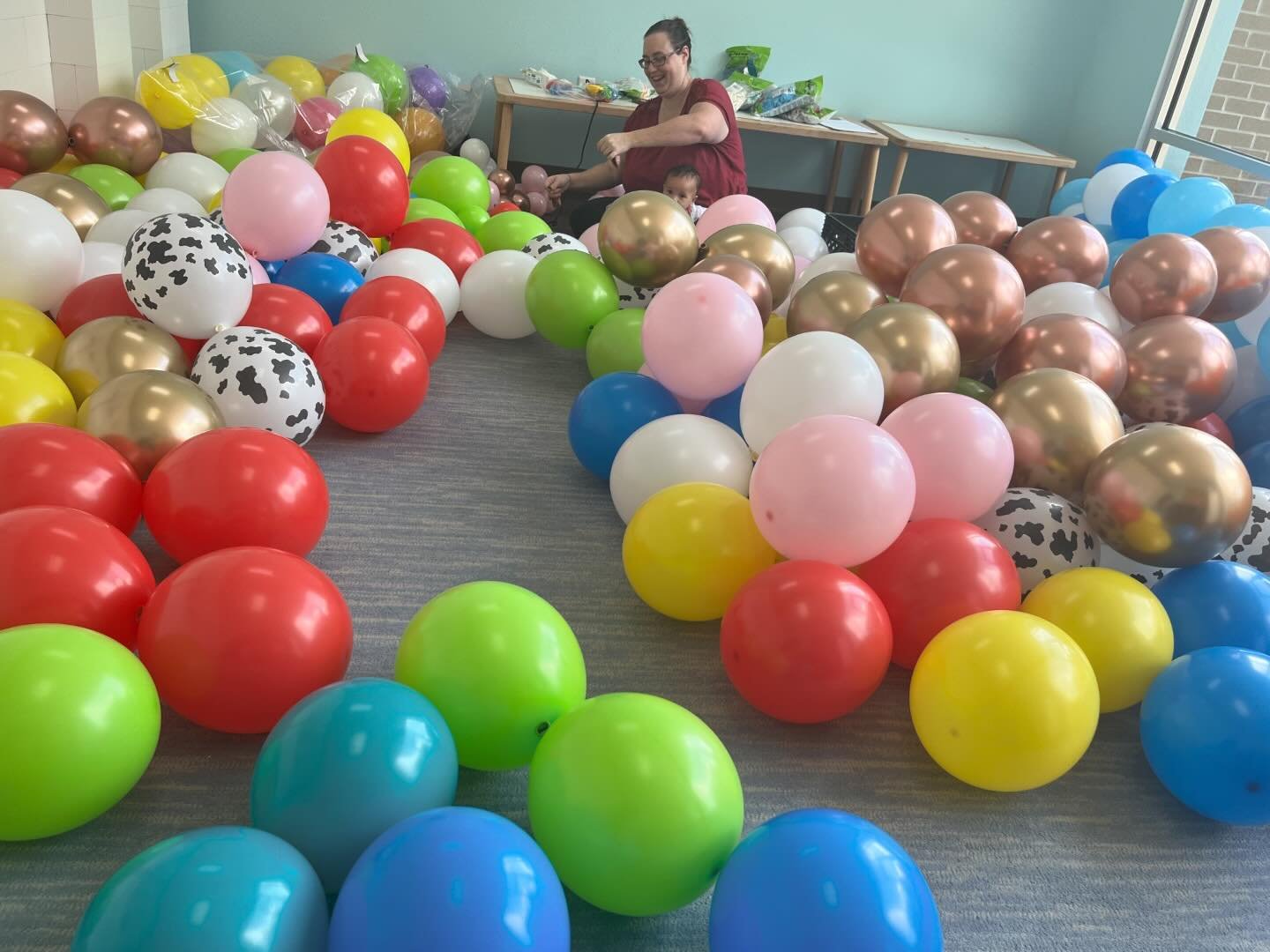 Party prep/balloon day is always a family adventure these days! If you&rsquo;ve been following us for a while you&rsquo;ll be excited for me that Maddie agrees to sit in mine or dad&rsquo;s lap for longer instead of nursing through balloon assembly n