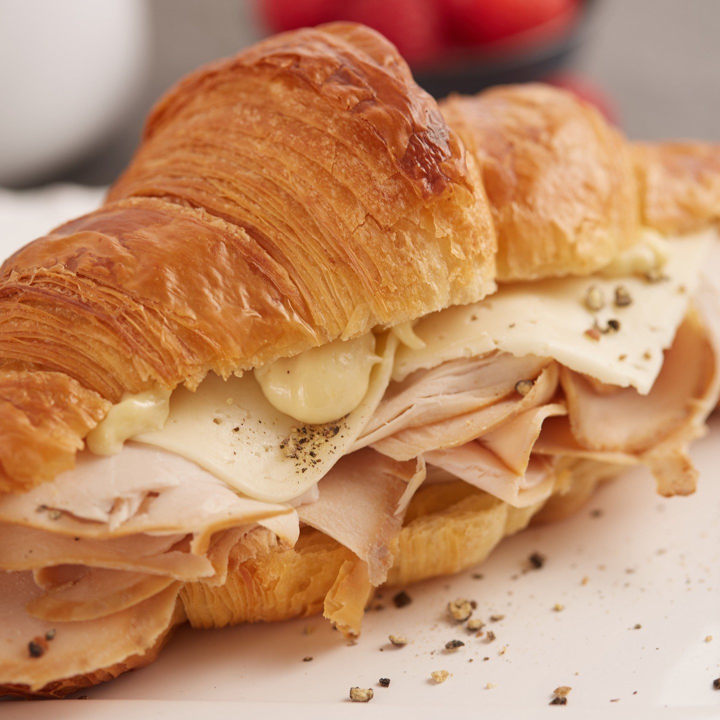 Wondering what to do for lunch today? Come visit us and let us solve that problem with our Turkey Sandwich! We layer smoked turkey, creamy havarti, and Dijon aioli on a freshly baked buttery, flaky croissant. See why Travel + Leisure once named it th