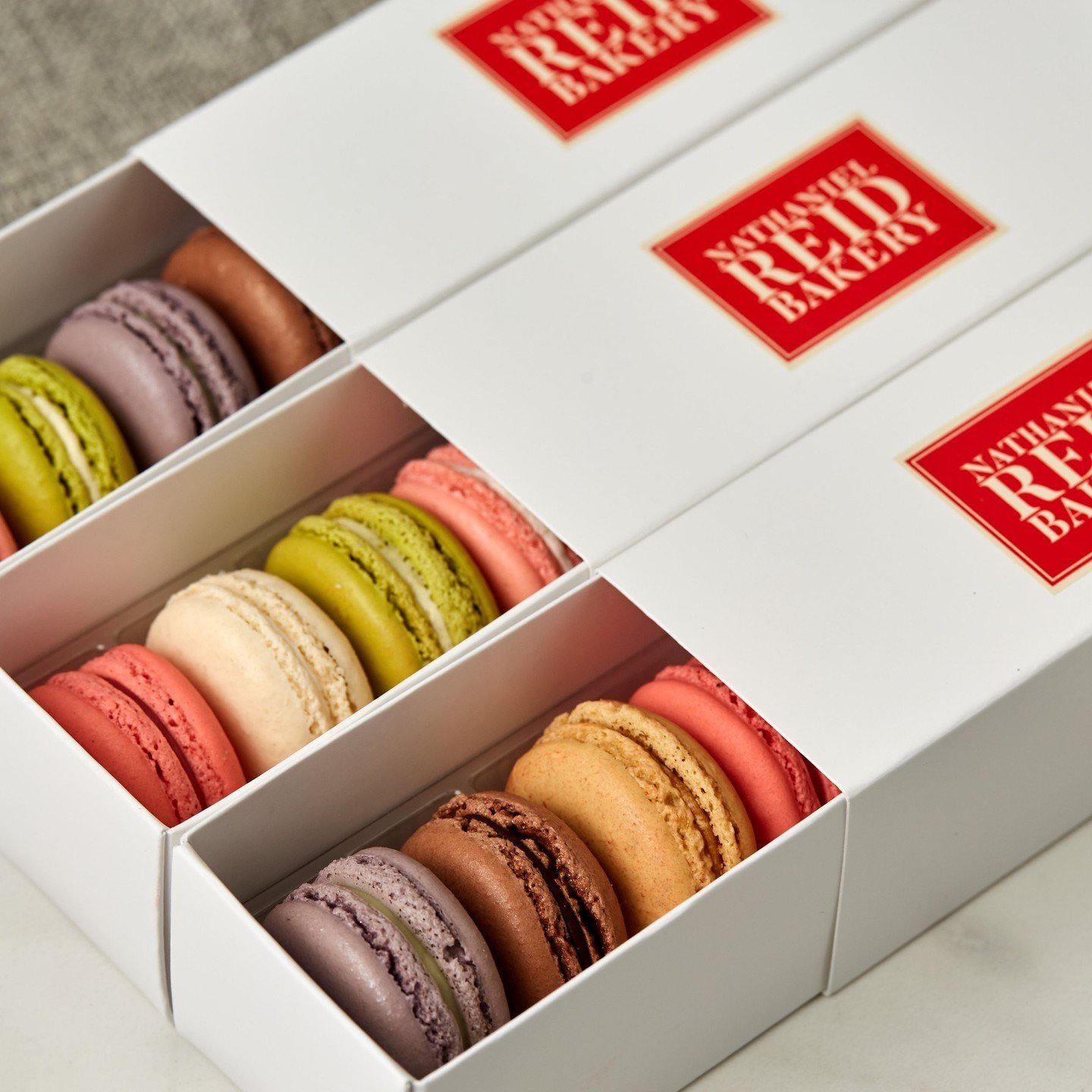 Celebrate mom this year with a box of her favorite macarons! Available in 9 seasonal flavors, these sweet sandwich cookies are sure to put a smile on her face. Order online at https://buff.ly/40WF5R5!